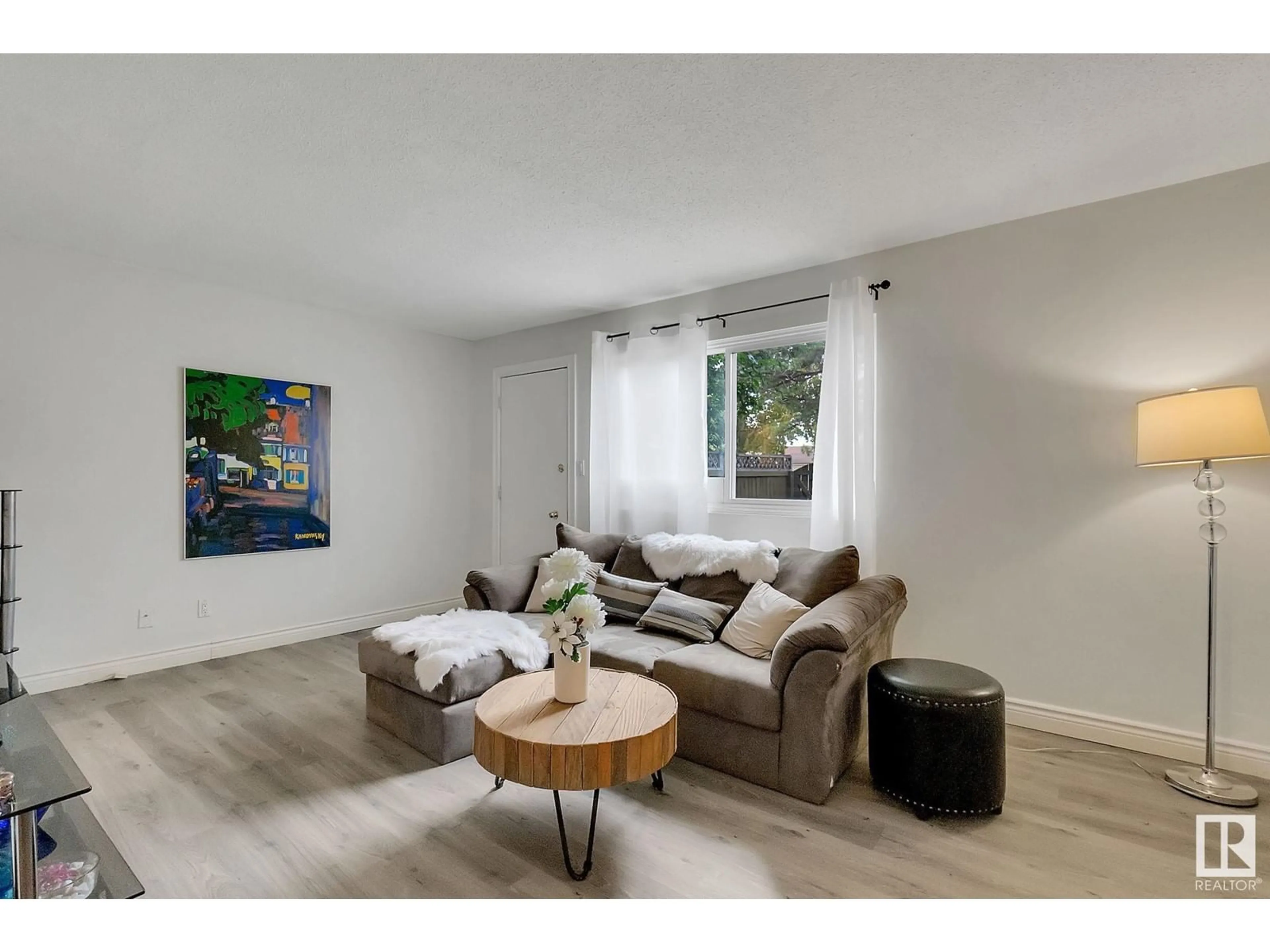 Living room with furniture, wood/laminate floor for 904 ABBOTTSFIELD RD NW, Edmonton Alberta T5W2A1