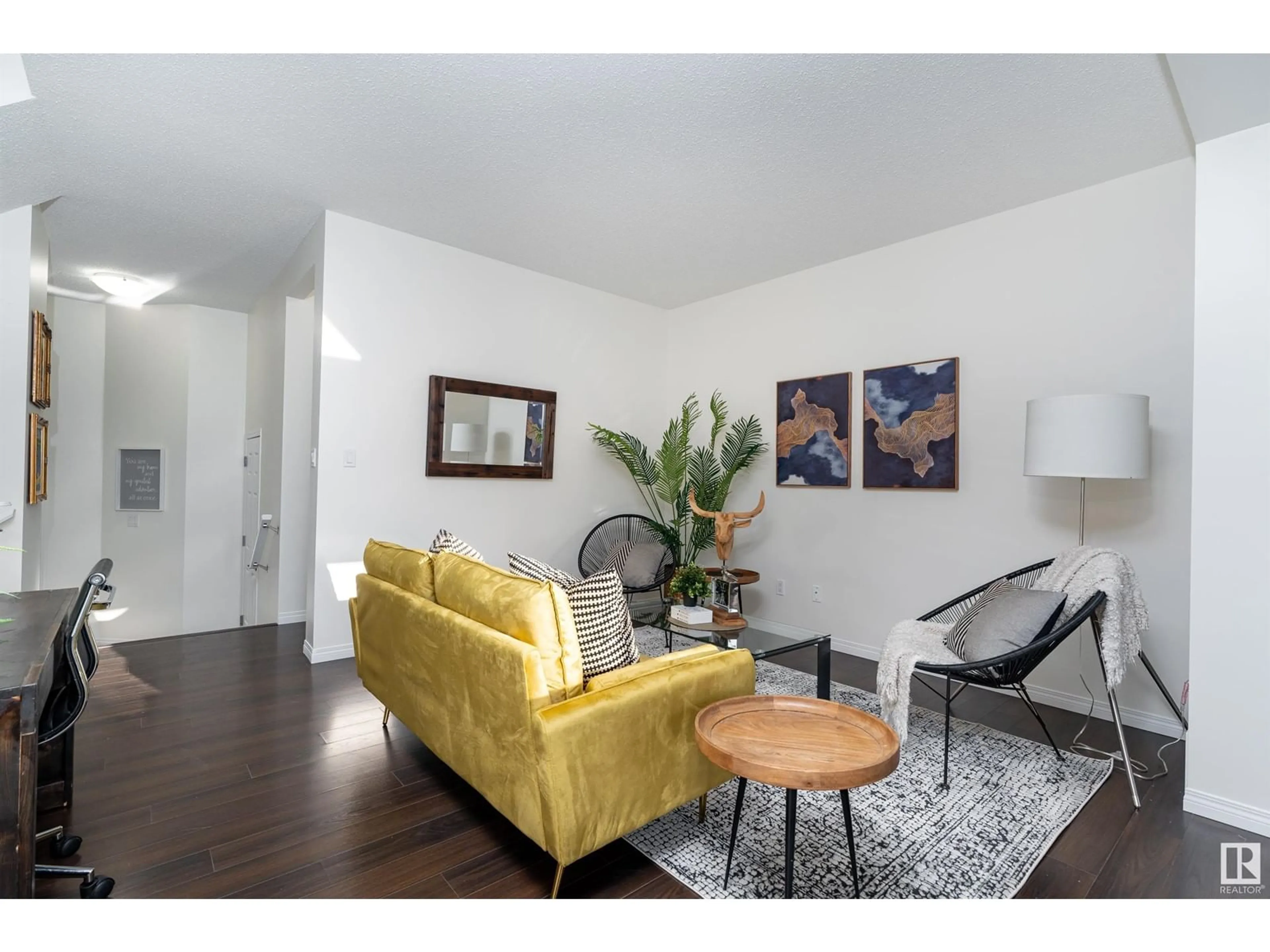 Living room with furniture, wood/laminate floor for 507 STURTZ LI, Leduc Alberta T9E0Y6