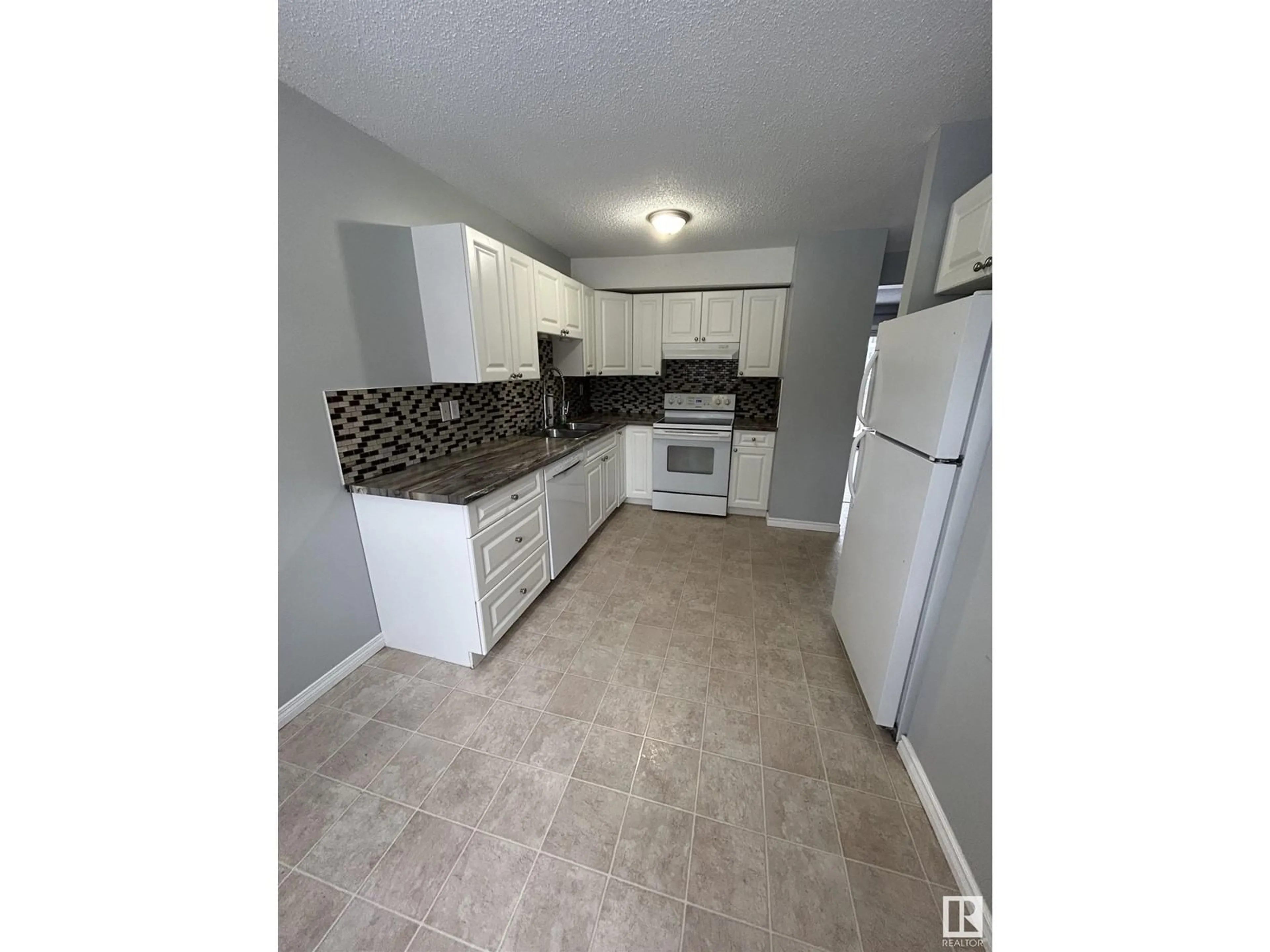 Standard kitchen, ceramic/tile floor for 1277 Hooke RD NW NW, Edmonton Alberta T5A4A5