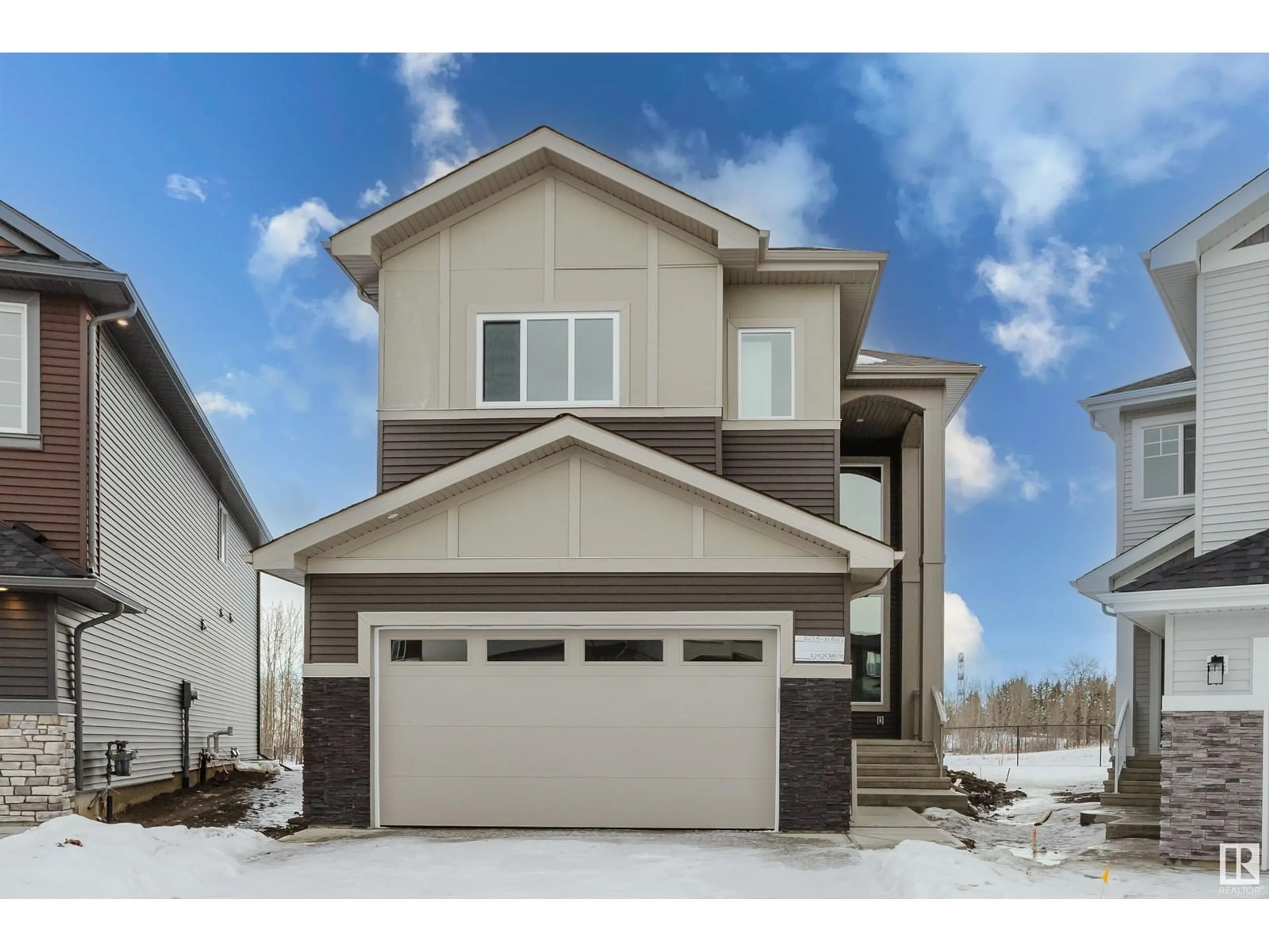 Home with vinyl exterior material, street for 1435 11 AV NW, Edmonton Alberta T6T2W4