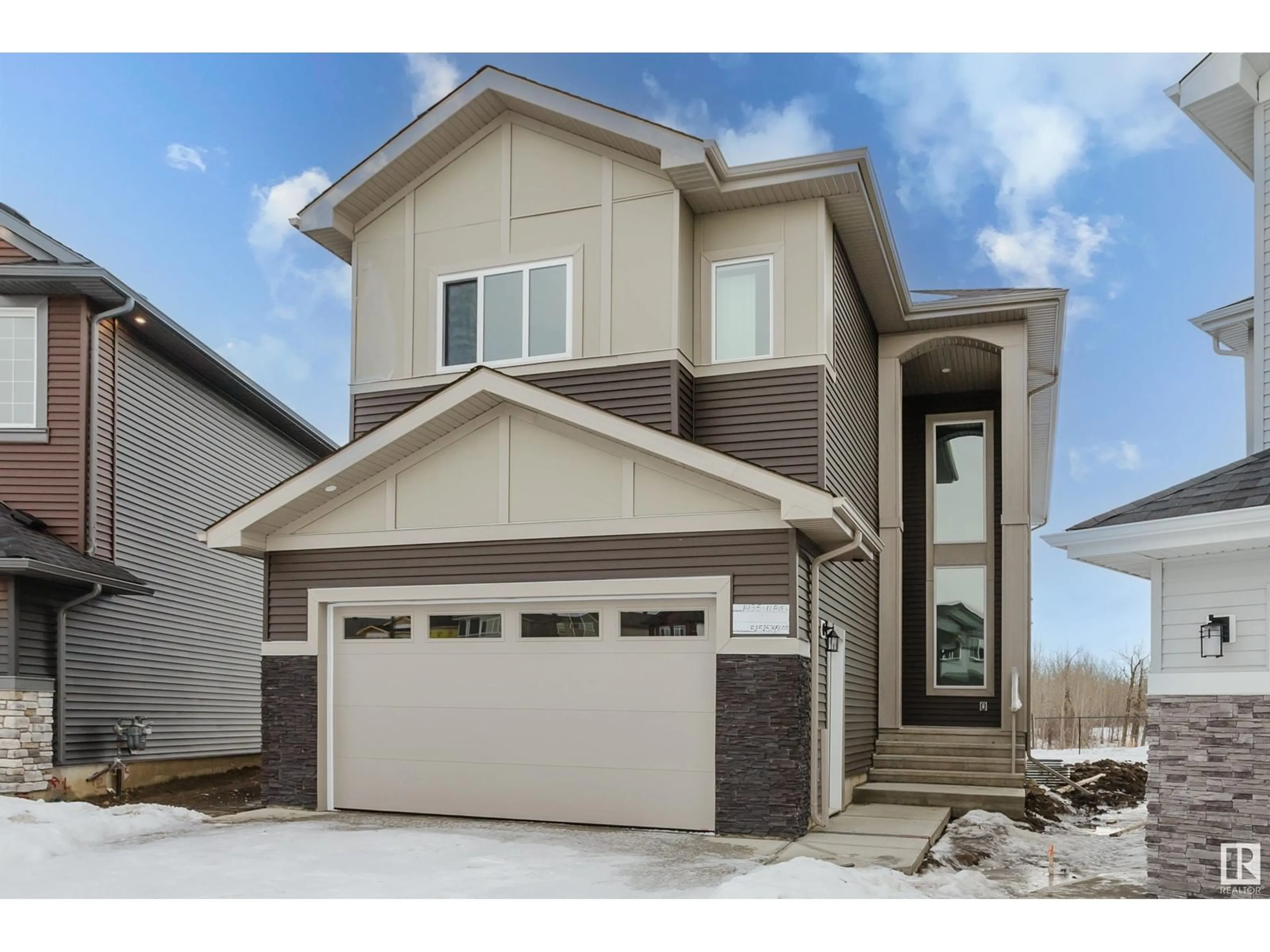 Home with vinyl exterior material, street for 1435 11 AV NW, Edmonton Alberta T6T2W4