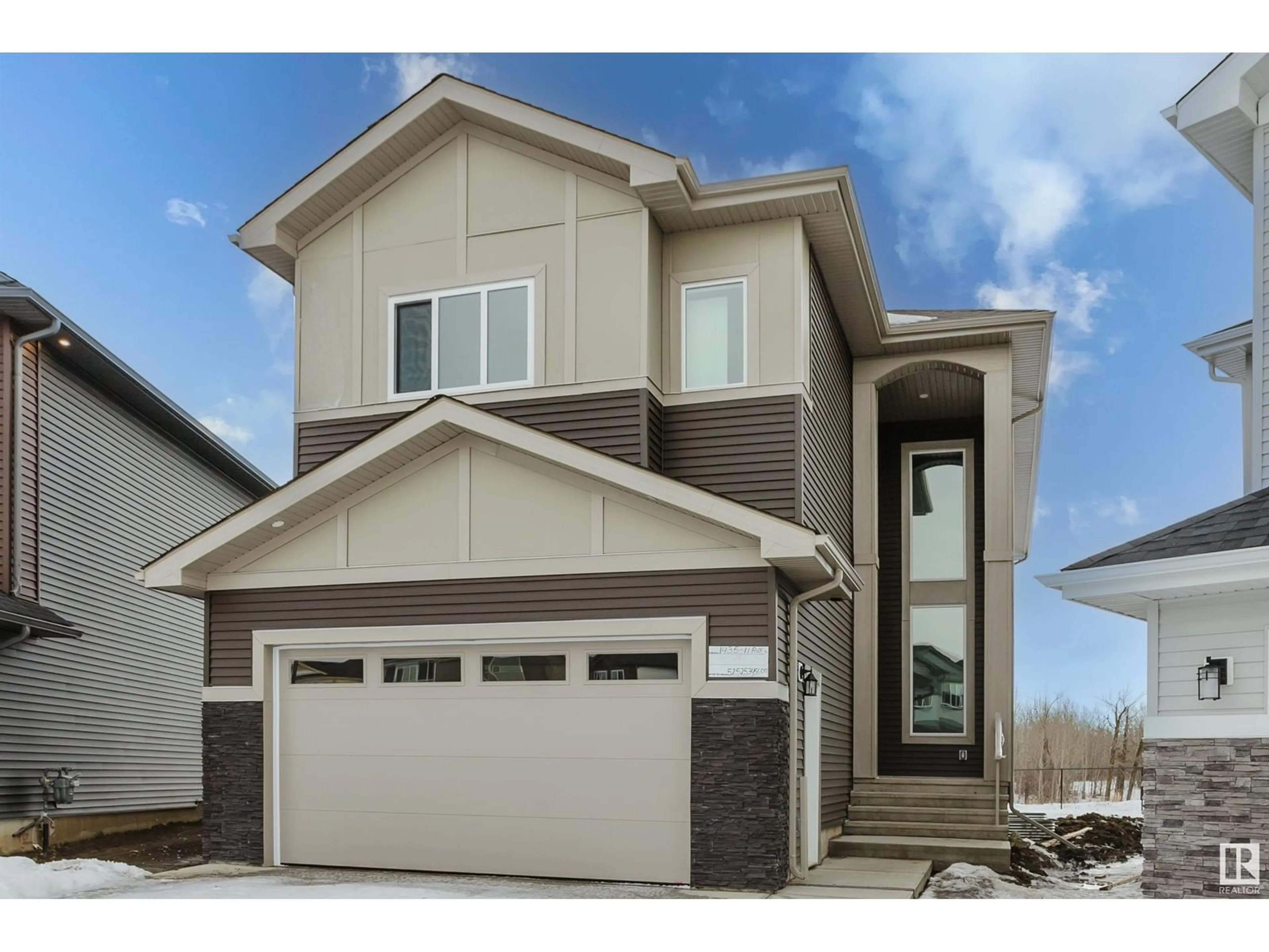 Home with vinyl exterior material, street for 1435 11 AV NW, Edmonton Alberta T6T2W4