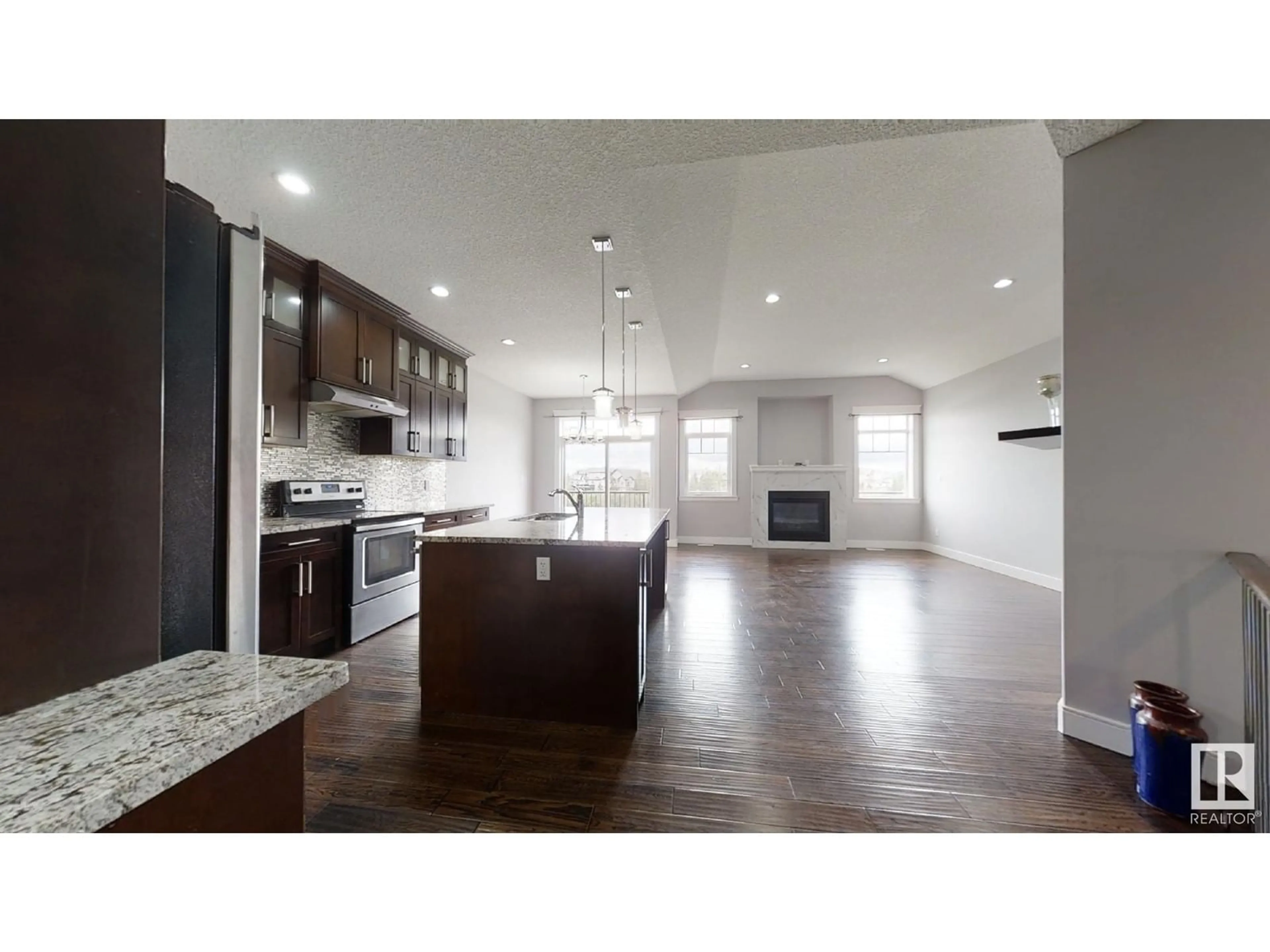 Open concept kitchen, wood/laminate floor for 75 SELKIRK PL, Leduc Alberta T9E0L5