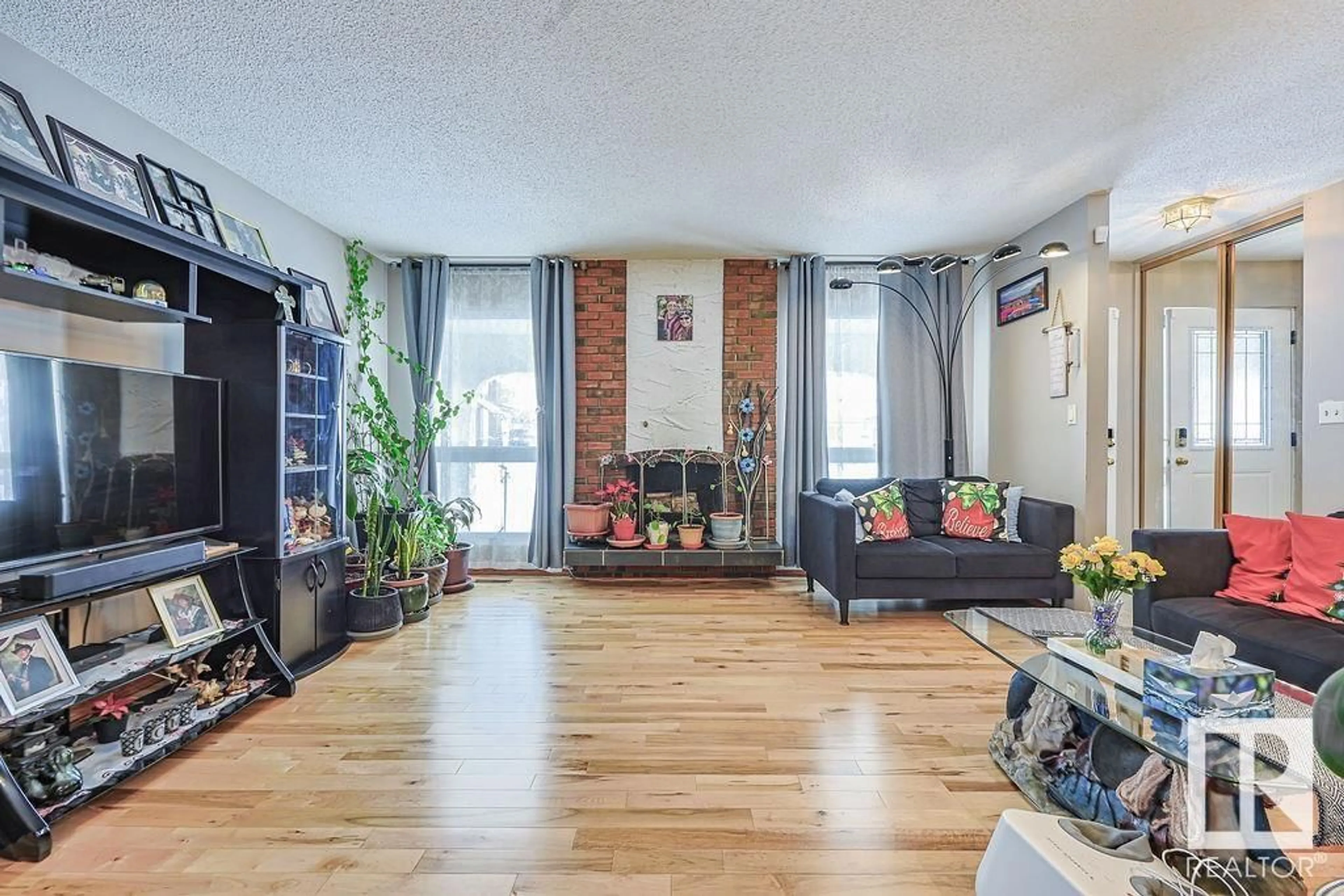 Living room with furniture, wood/laminate floor for 14720 117 ST NW, Edmonton Alberta T5X1K1