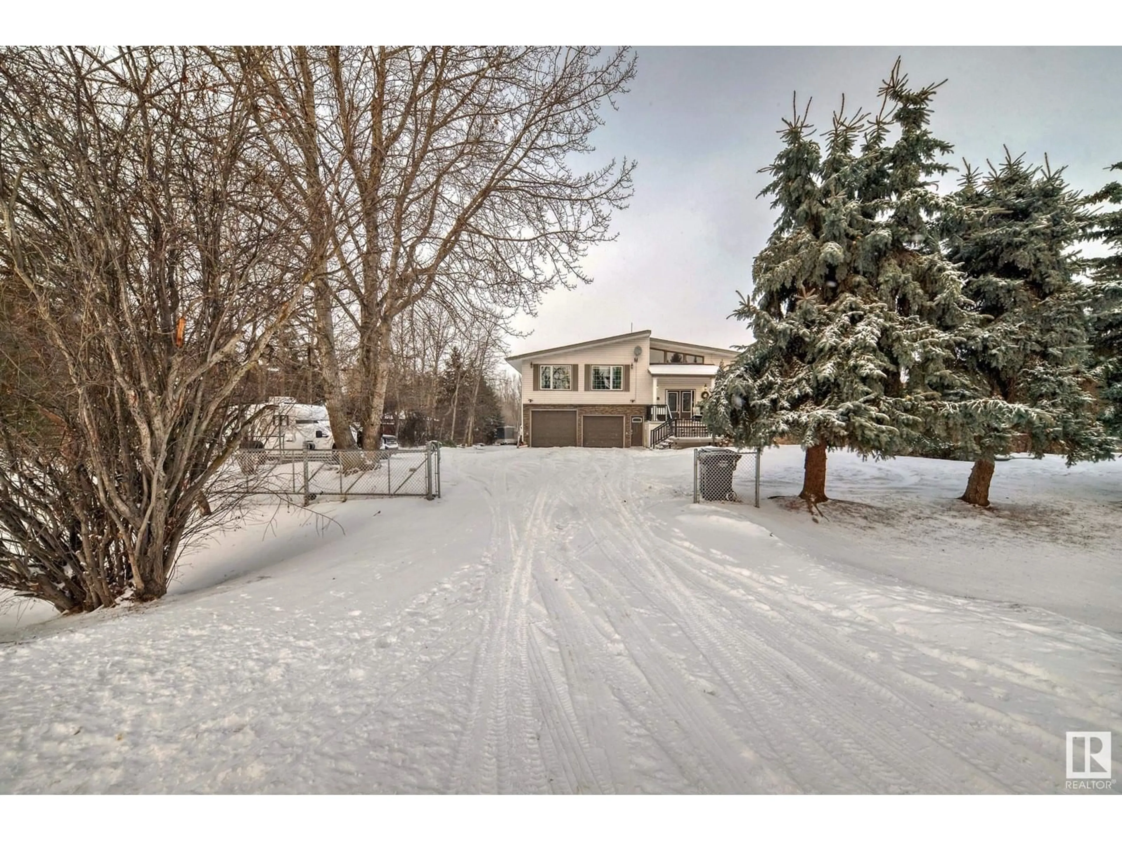 A pic from outside/outdoor area/front of a property/back of a property/a pic from drone, street for #17 53304 HGHWAY 44, Rural Parkland County Alberta T7X3A3