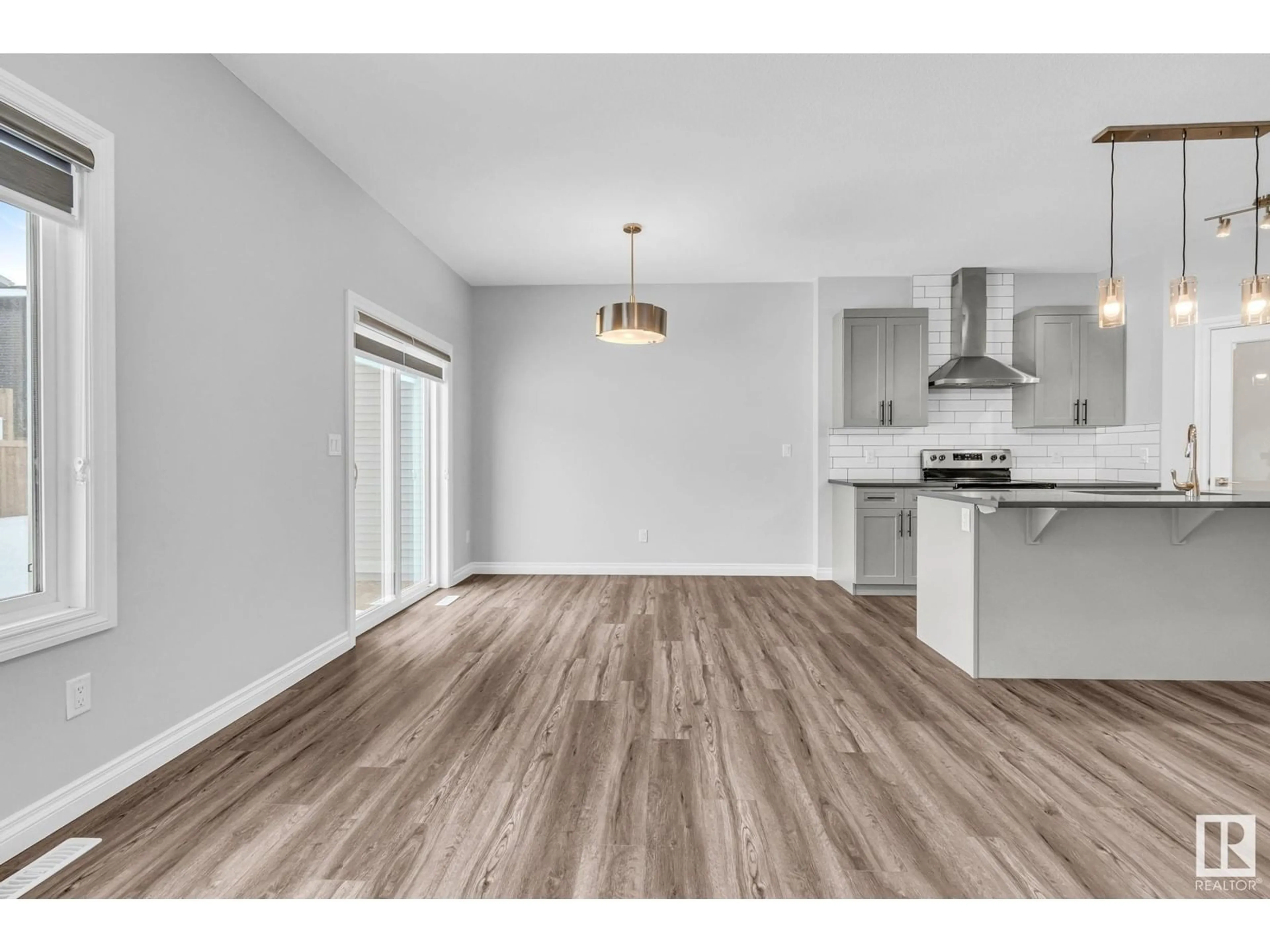 Open concept kitchen, wood/laminate floor for 9232 pear DR SW SW, Edmonton Alberta T6X2X5