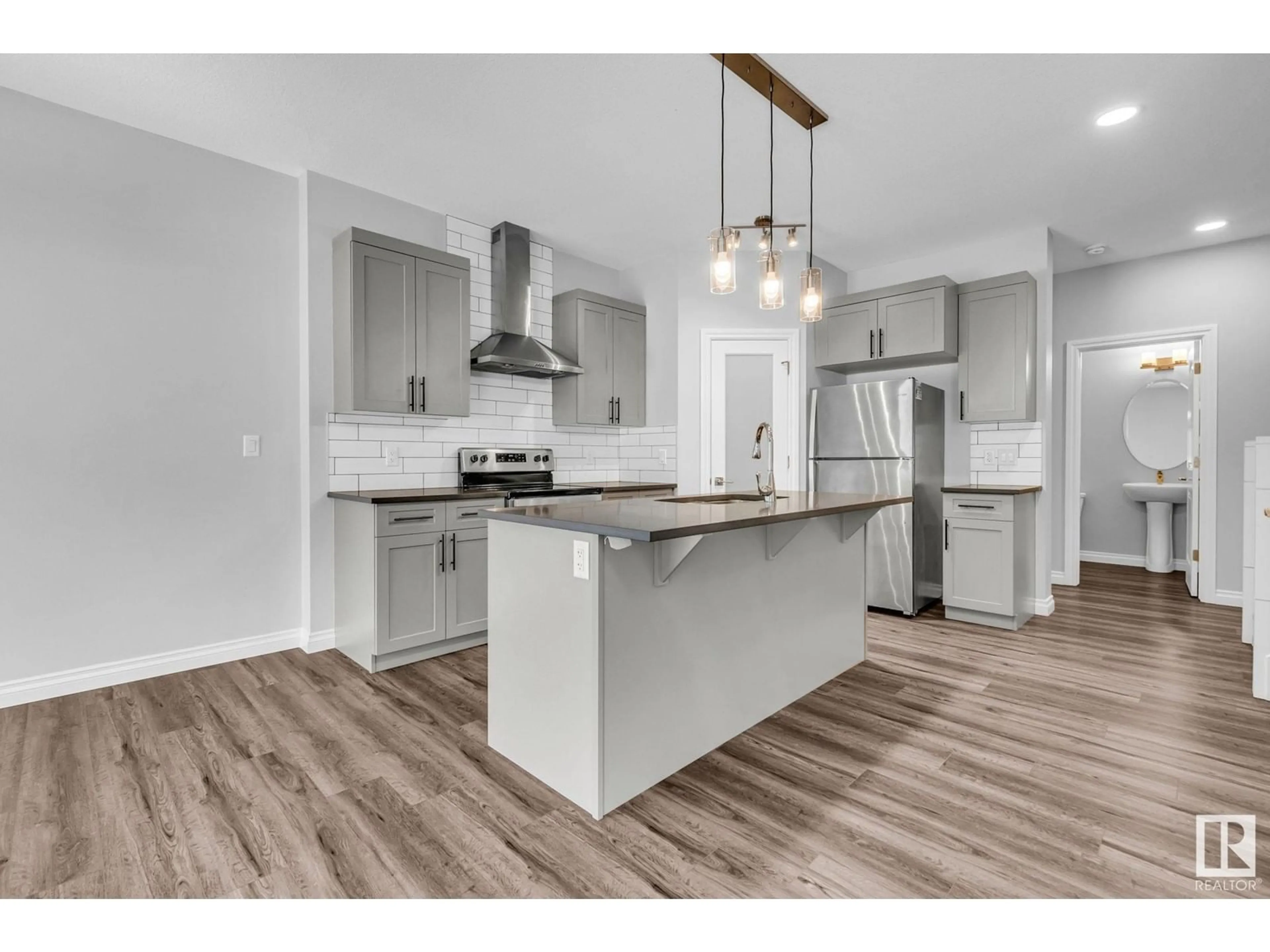 Open concept kitchen, wood/laminate floor for 9232 pear DR SW SW, Edmonton Alberta T6X2X5