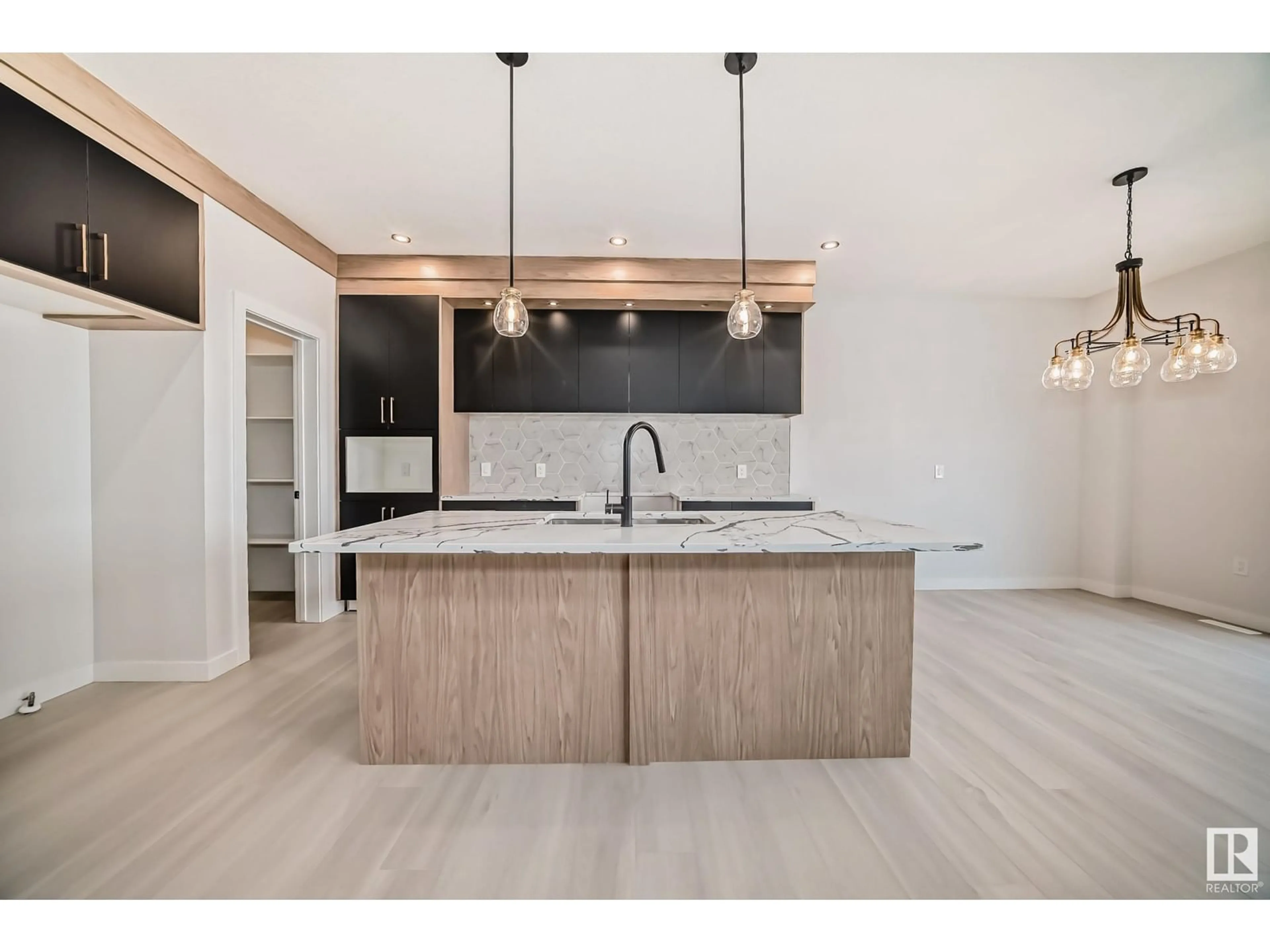 Open concept kitchen, wood/laminate floor for 65 ASHBURY CR, Spruce Grove Alberta T7X3C6