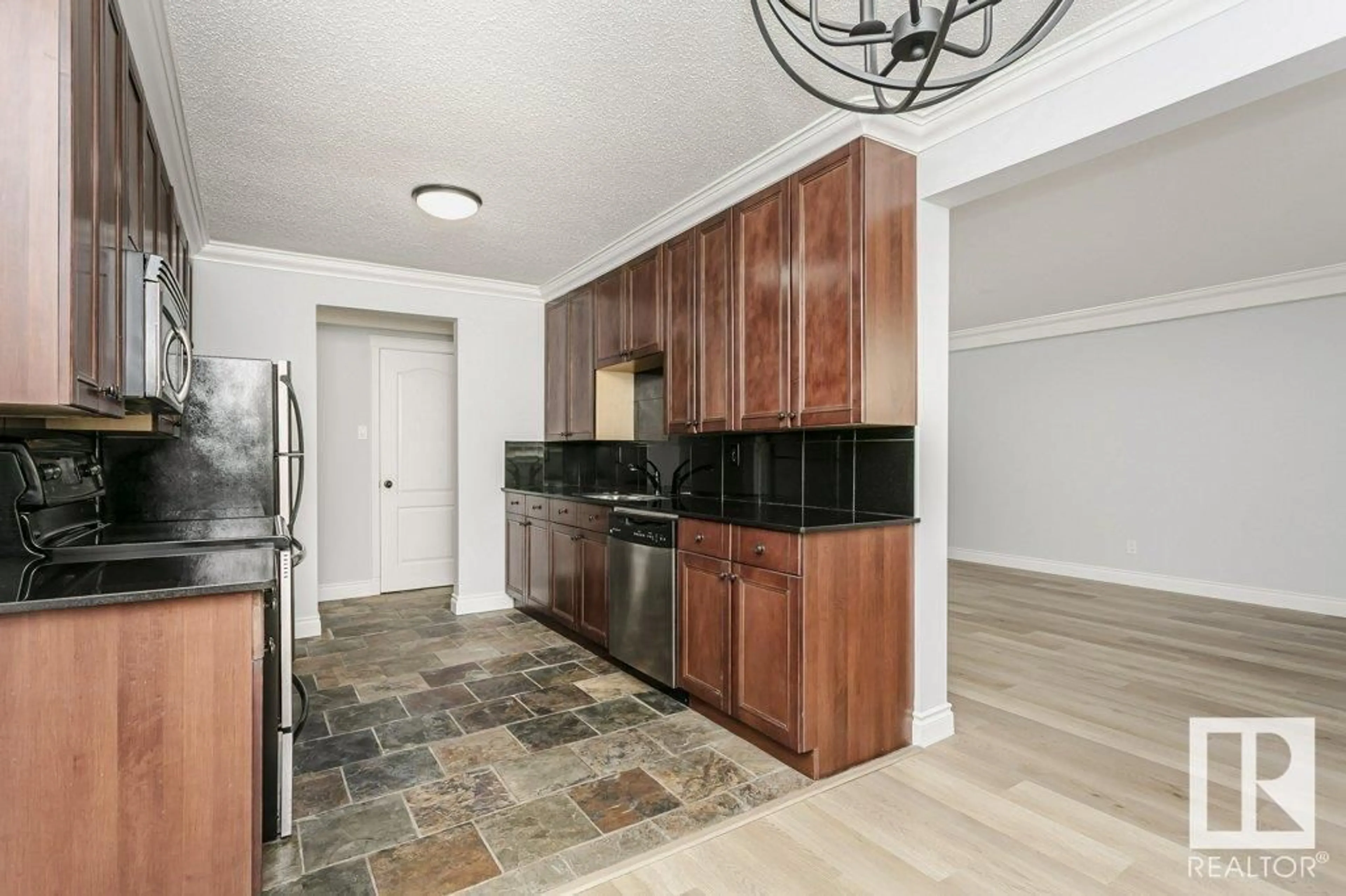 Open concept kitchen, ceramic/tile floor for #107 10745 83 AV NW, Edmonton Alberta T6E2E5