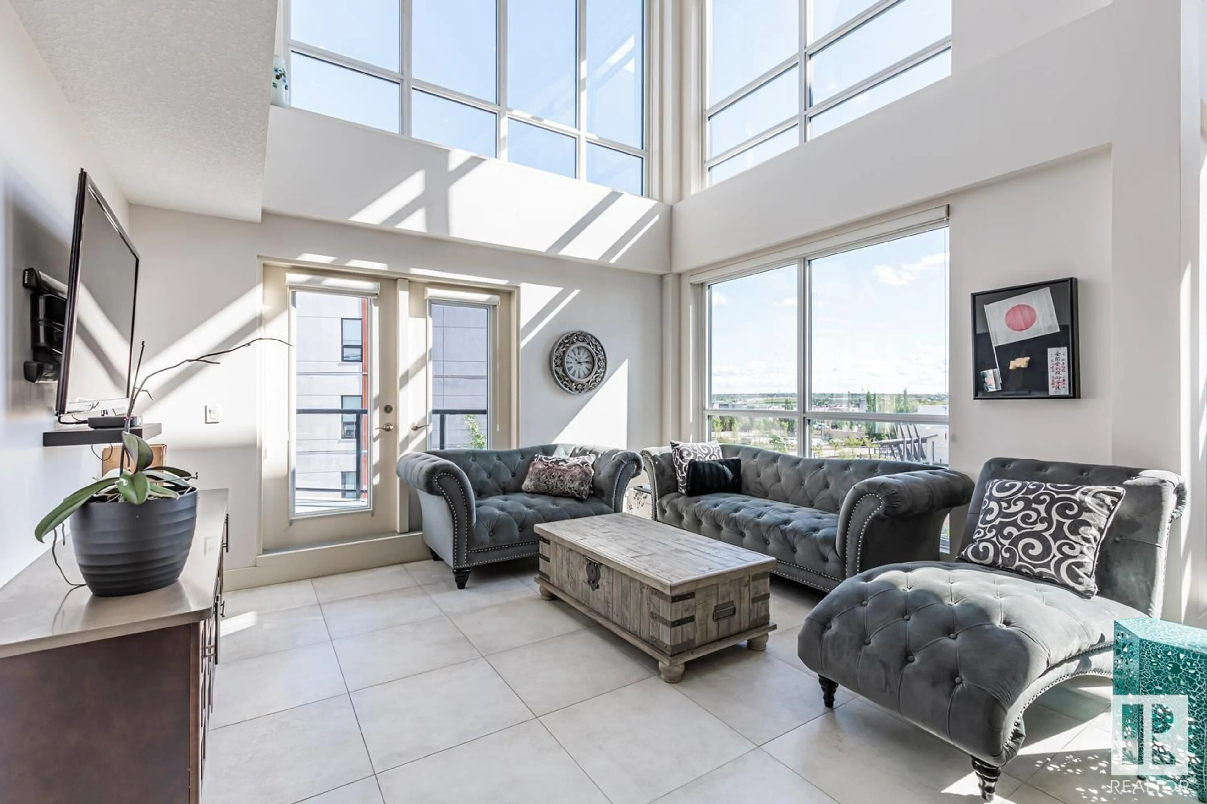 Living room with furniture, unknown for #406 1350 WINDERMERE WY SW, Edmonton Alberta T6W2J3