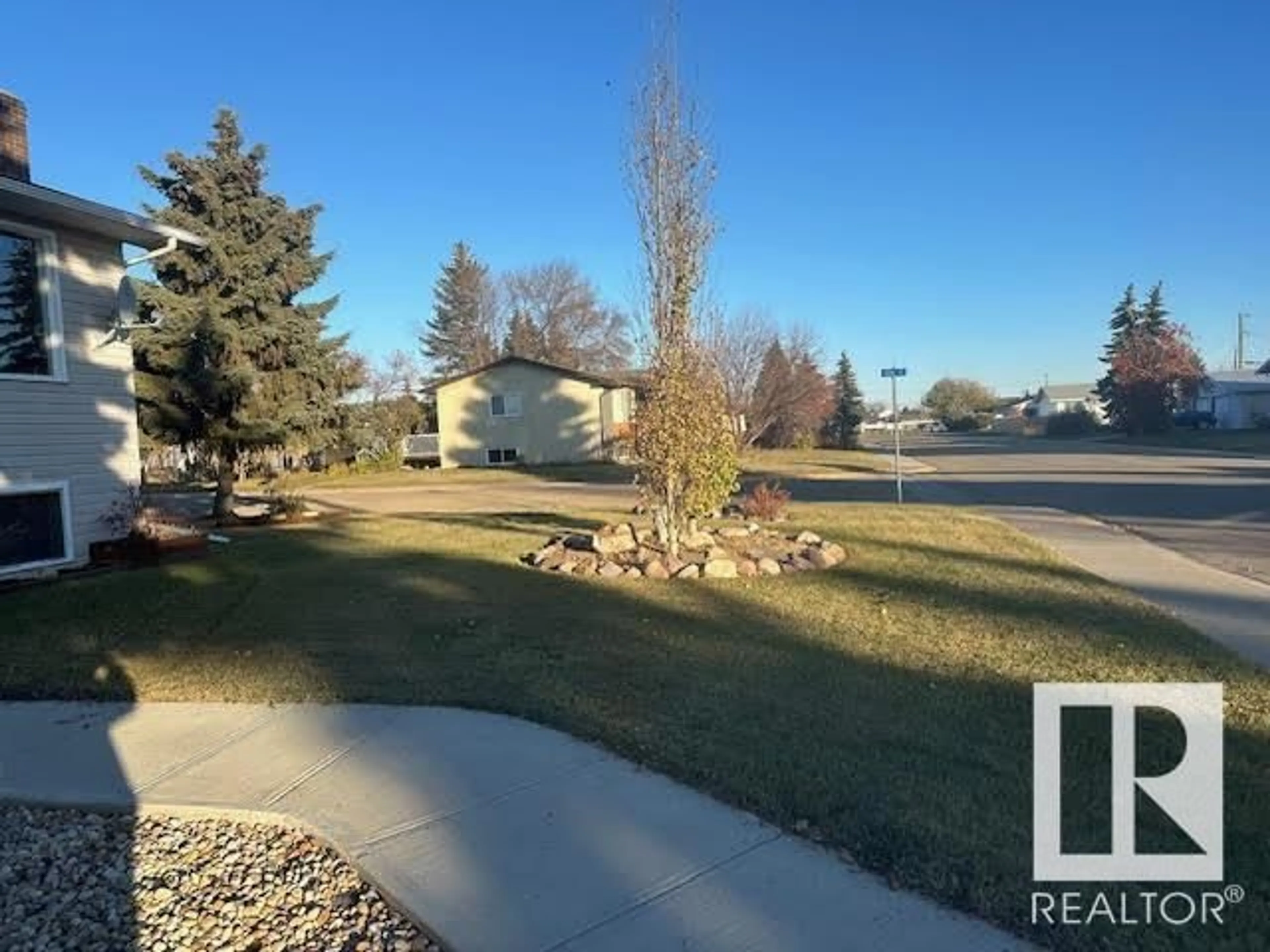 A pic from outside/outdoor area/front of a property/back of a property/a pic from drone, water/lake/river/ocean view for 5702 48A ST, Vegreville Alberta T9C0G7