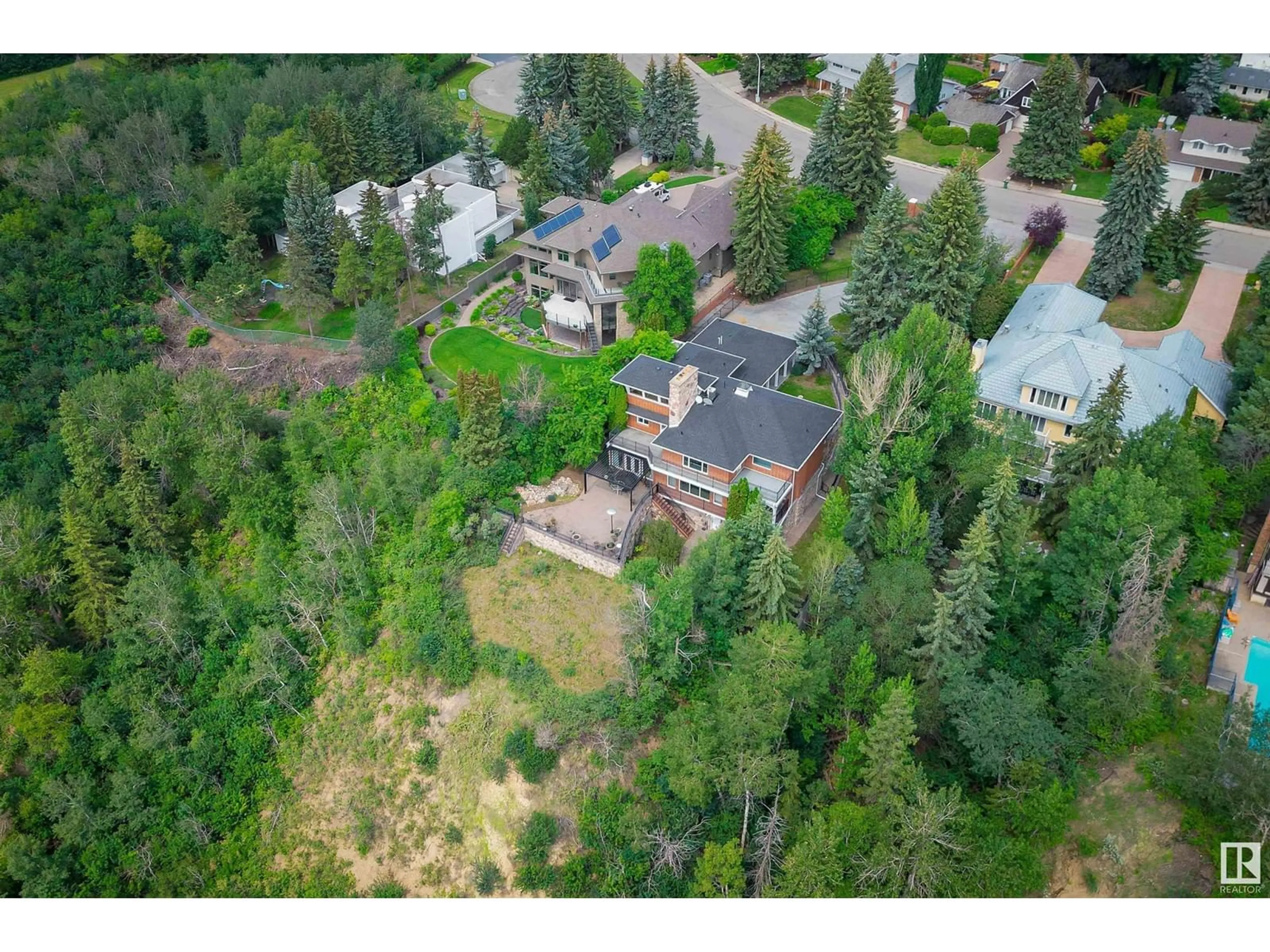 A pic from outside/outdoor area/front of a property/back of a property/a pic from drone, forest/trees view for 179 QUESNELL CR NW, Edmonton Alberta T5R5P1