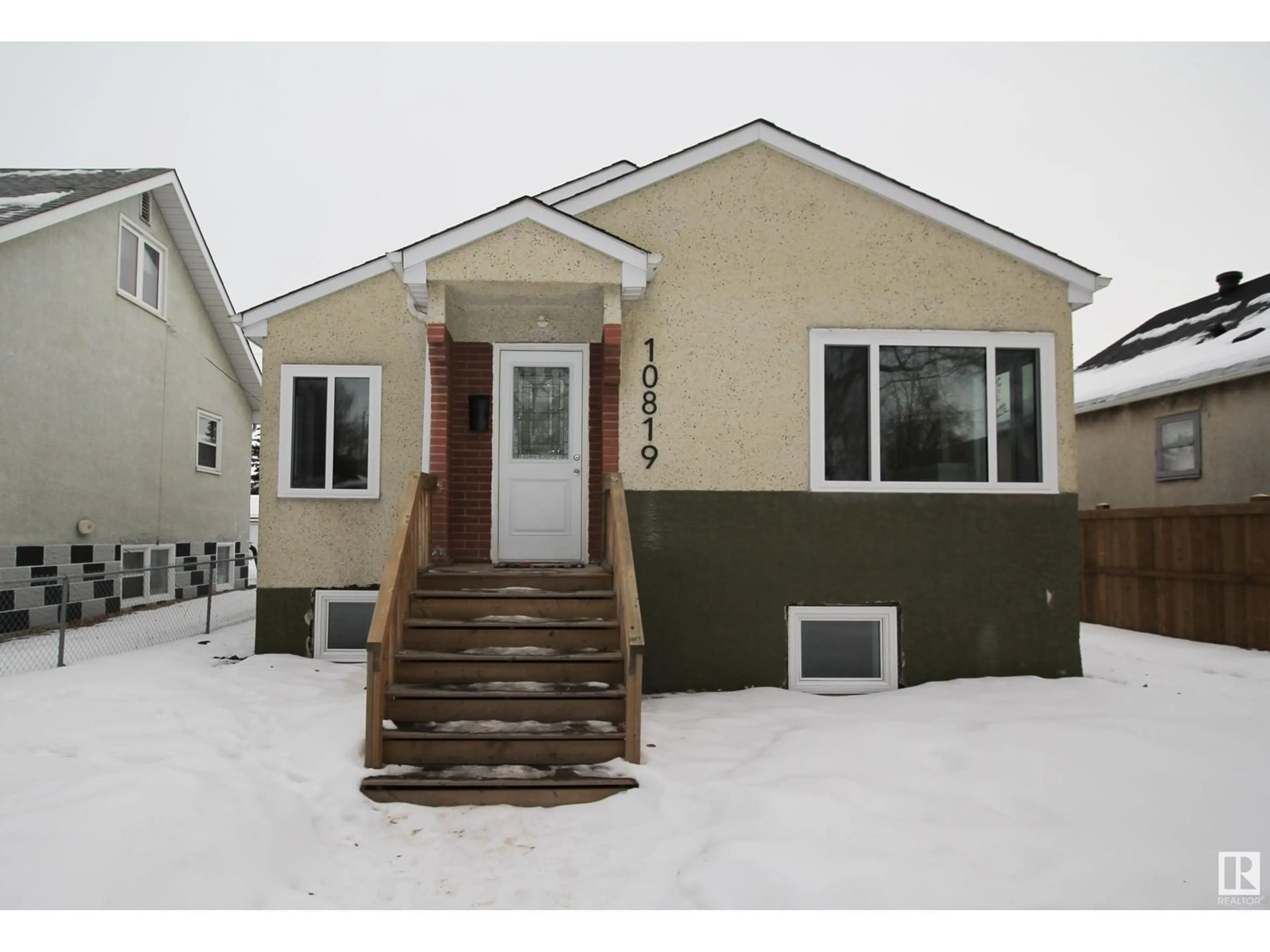 Home with vinyl exterior material, street for 10819 92 ST NW, Edmonton Alberta T5H1V5