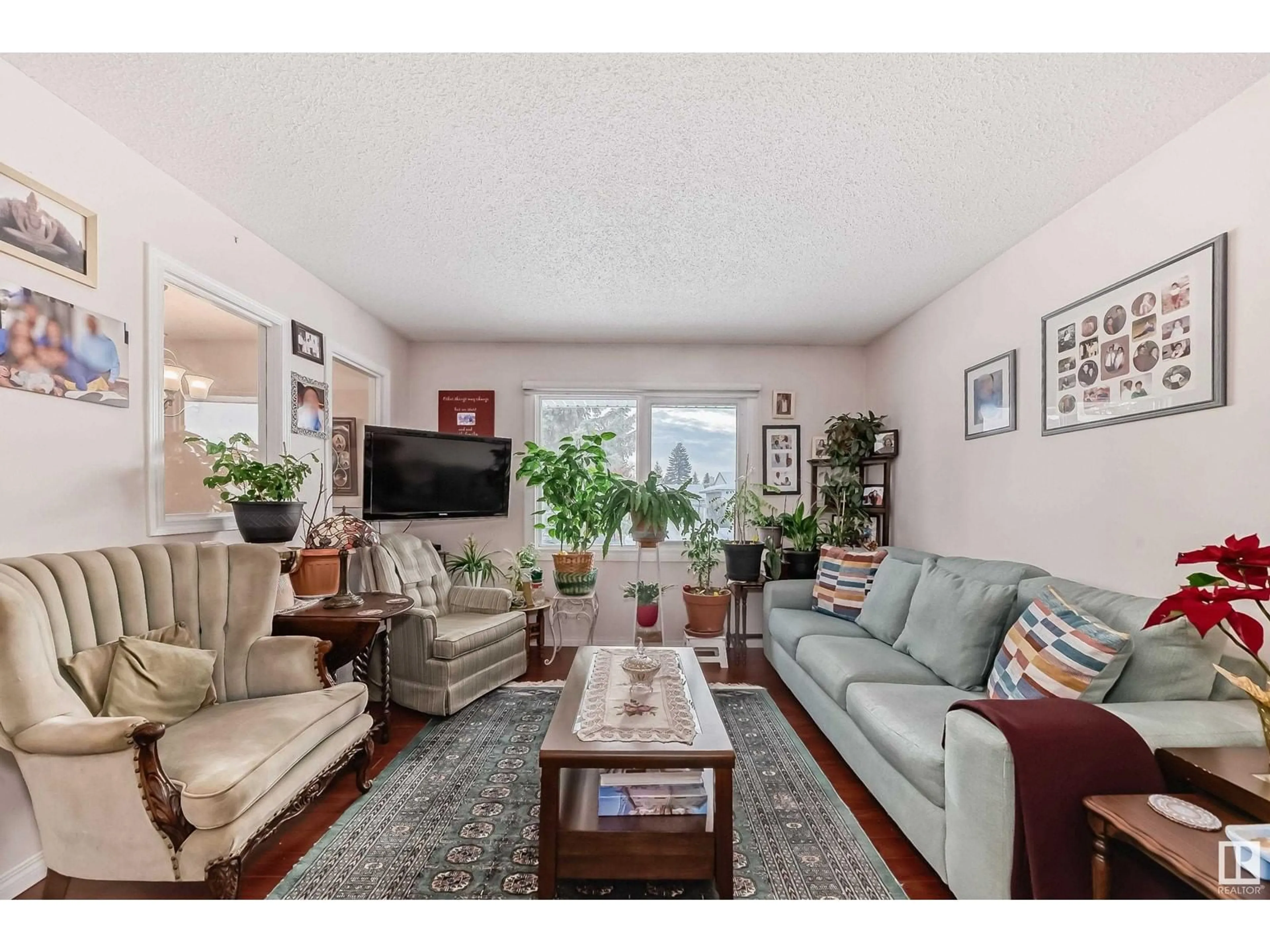 Living room with furniture, unknown for 9912 170 AV NW, Edmonton Alberta T8X3G2