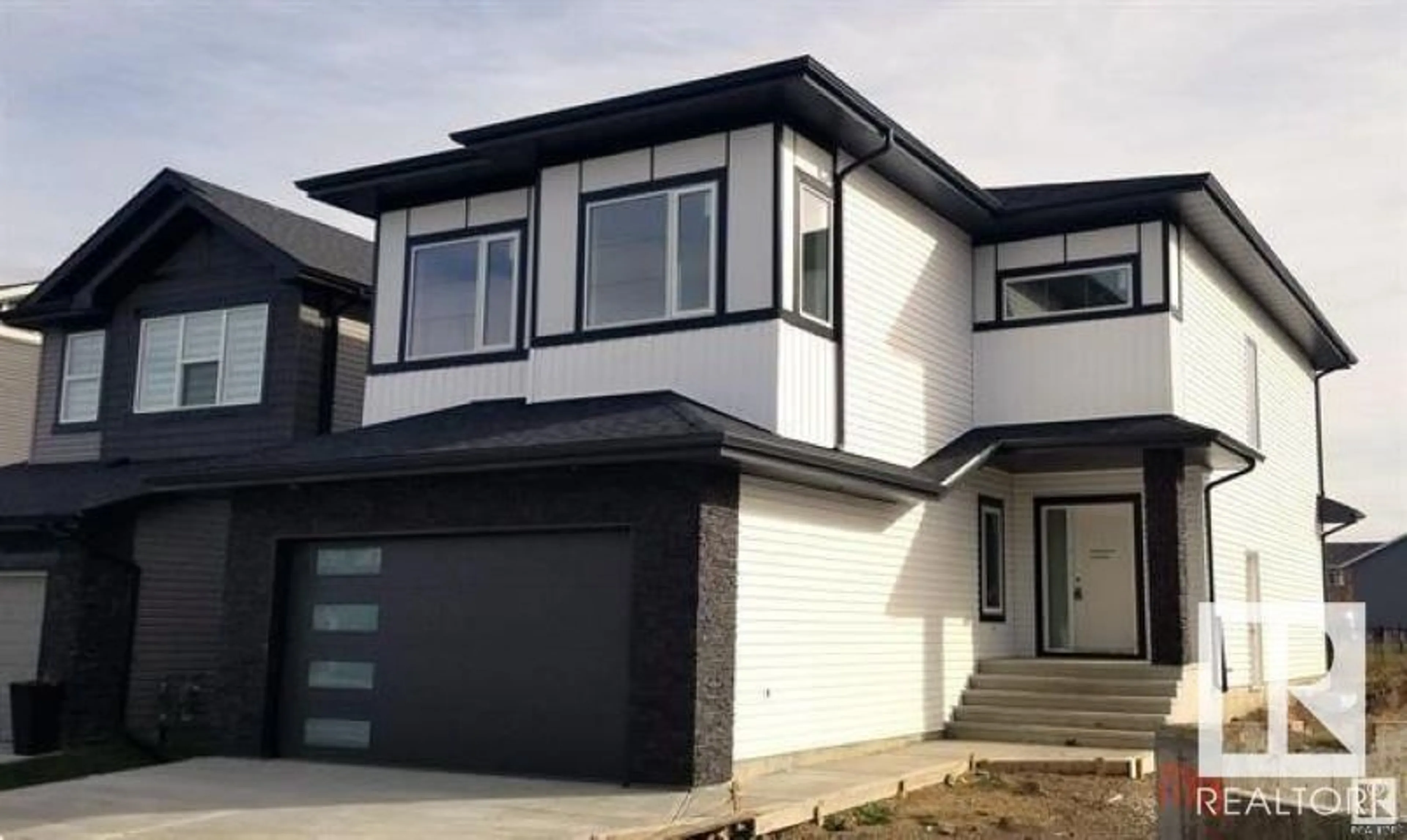 Home with vinyl exterior material, street for 17707 73 ST NW, Edmonton Alberta T5Z0V9