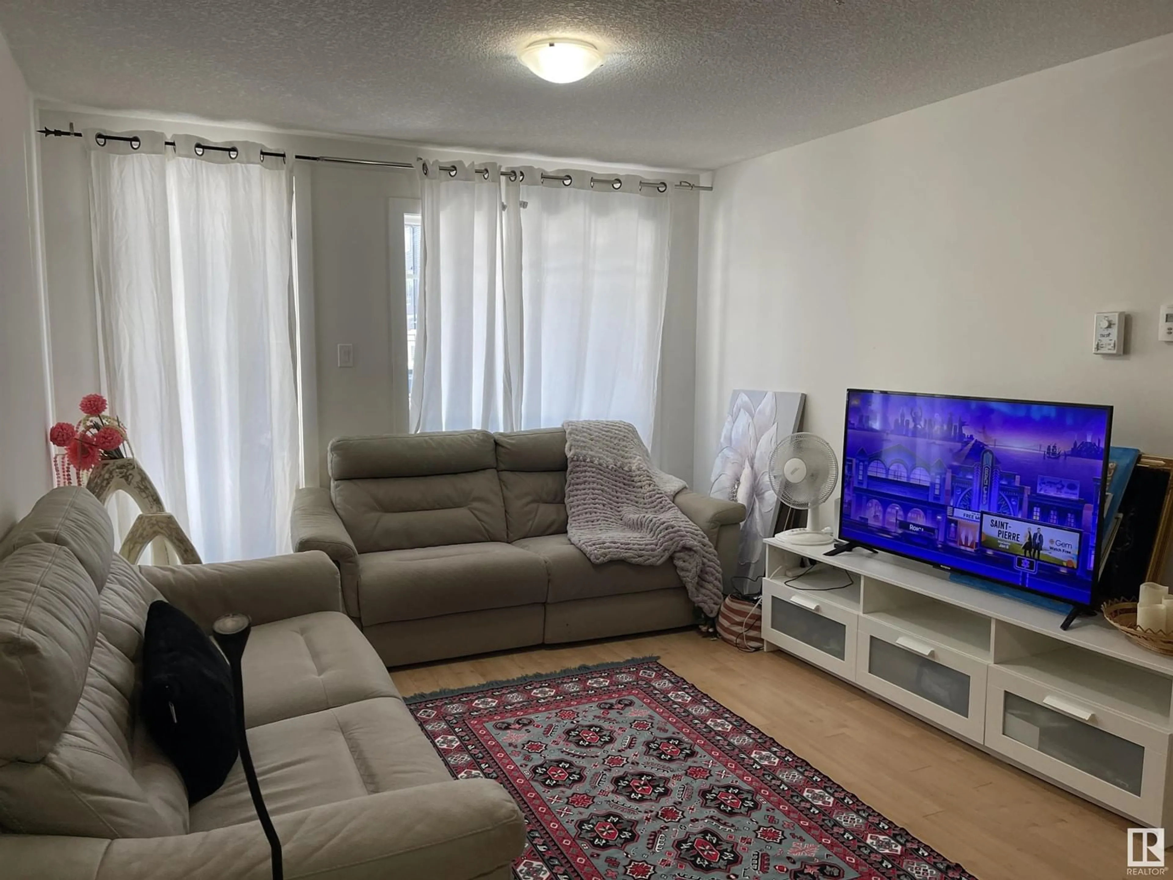 Living room with furniture, unknown for #112 9519 160 AV NW NW, Edmonton Alberta T5Z0N1