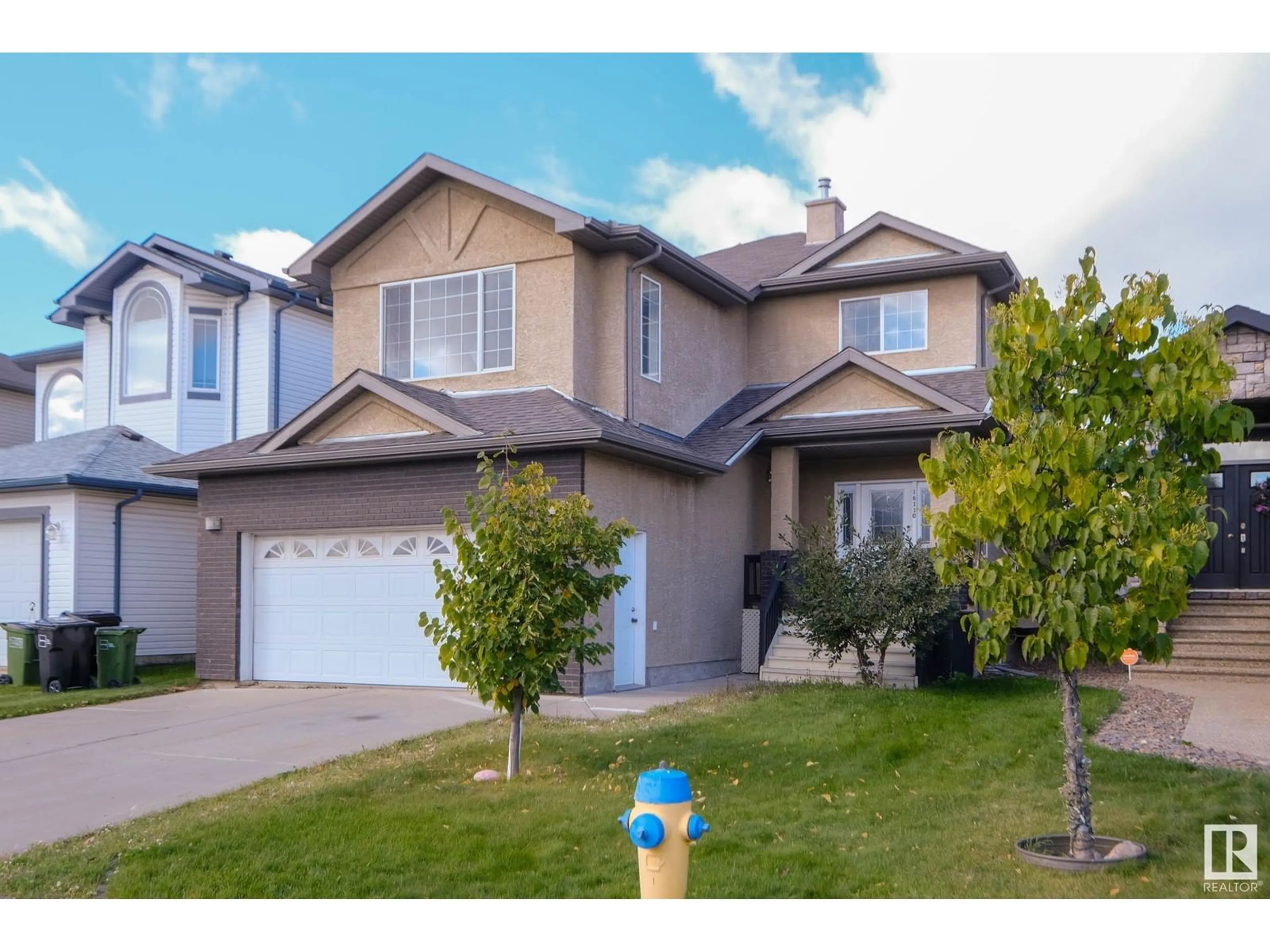 Home with vinyl exterior material, street for 16110 47 ST NW, Edmonton Alberta T5Y0G8