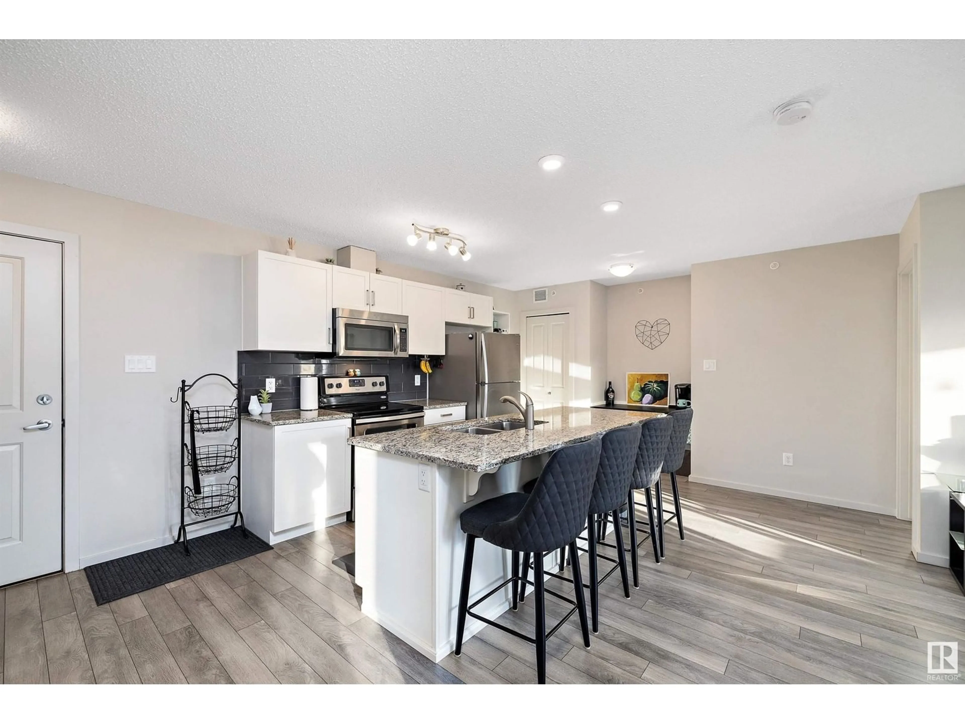 Open concept kitchen, unknown for #404 142 Ebbers BV NW, Edmonton Alberta T5Y3W2