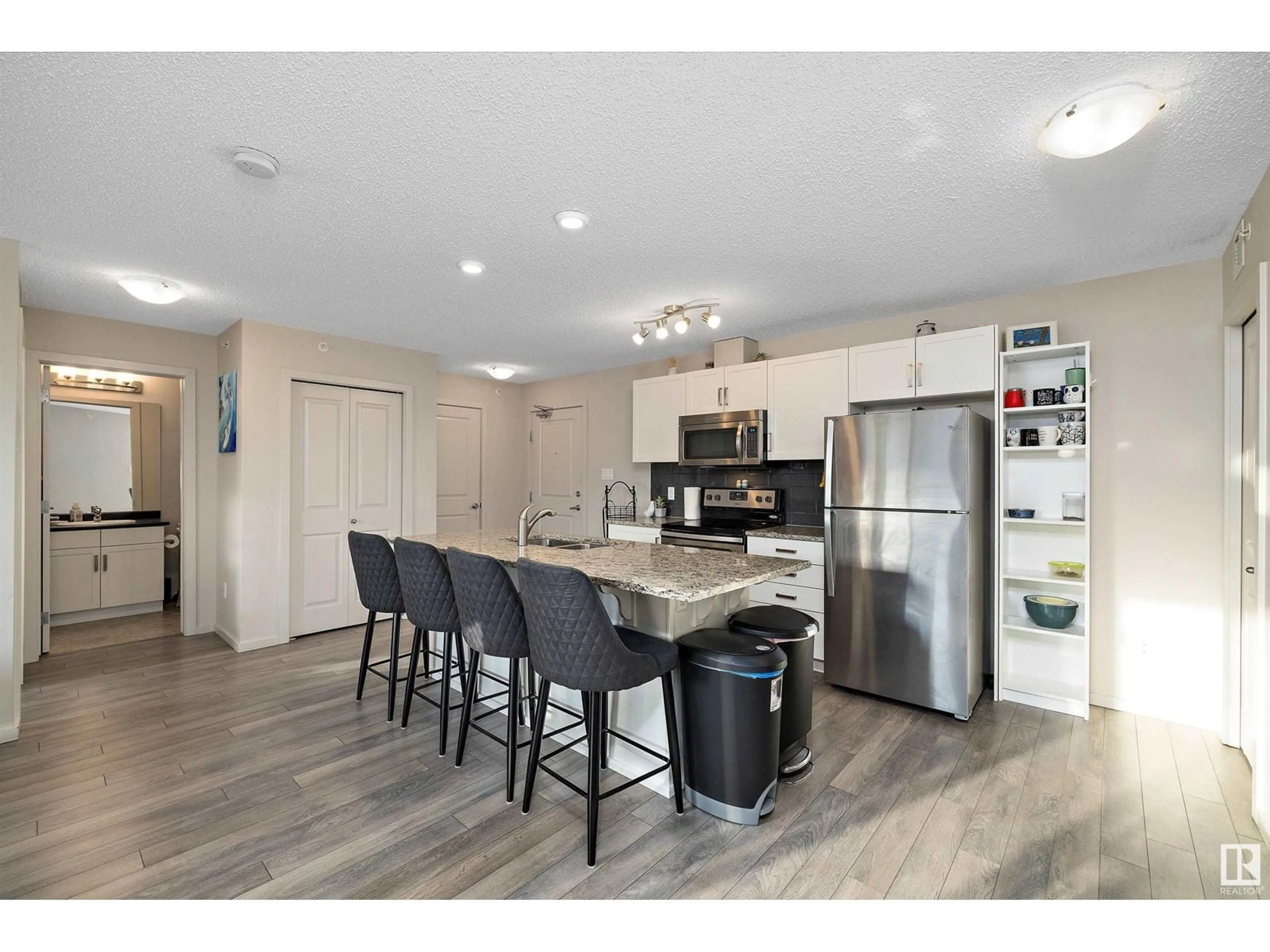 Open concept kitchen, unknown for #404 142 Ebbers BV NW, Edmonton Alberta T5Y3W2