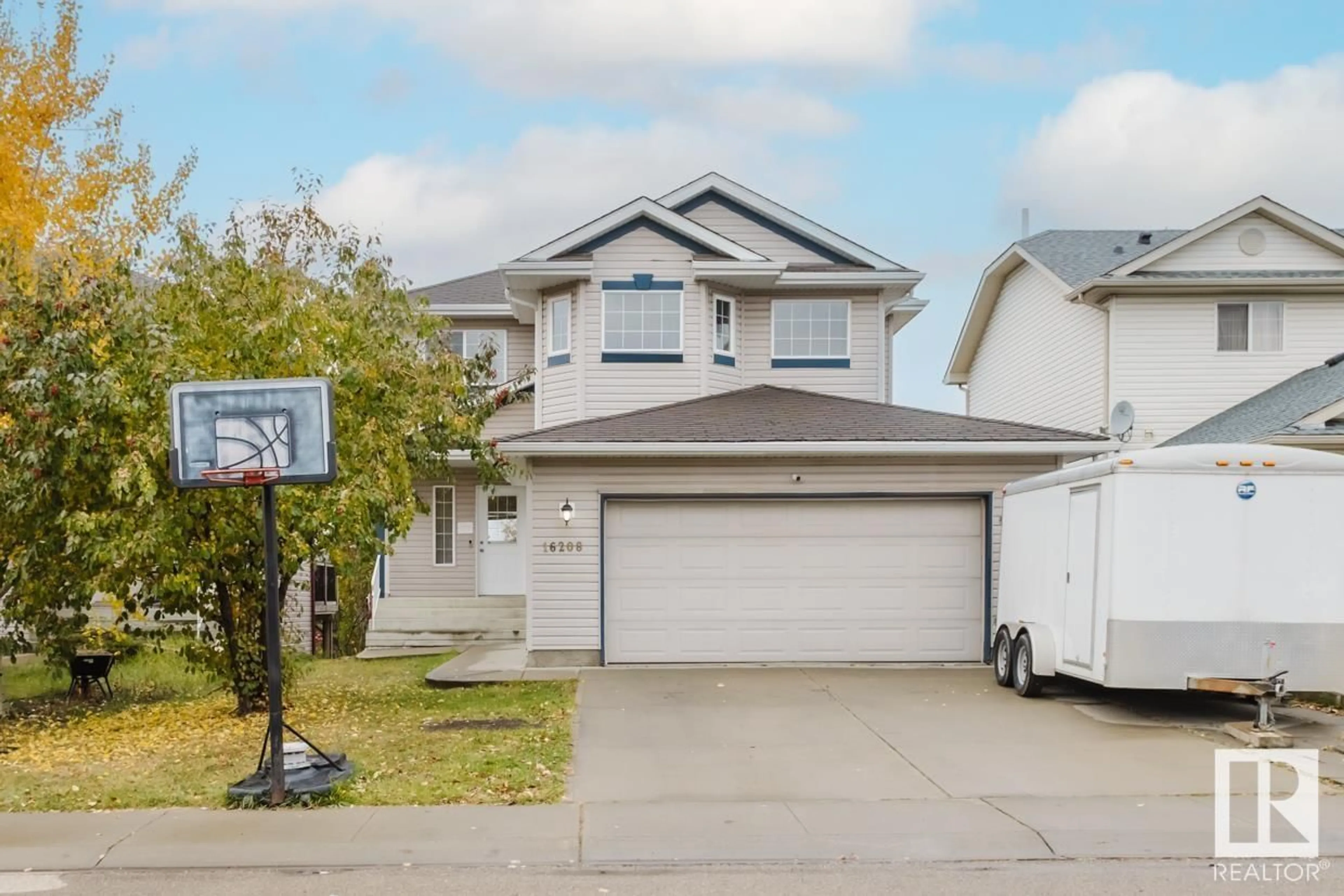 Home with vinyl exterior material, street for 16208 90 ST NW, Edmonton Alberta T5Z2P3