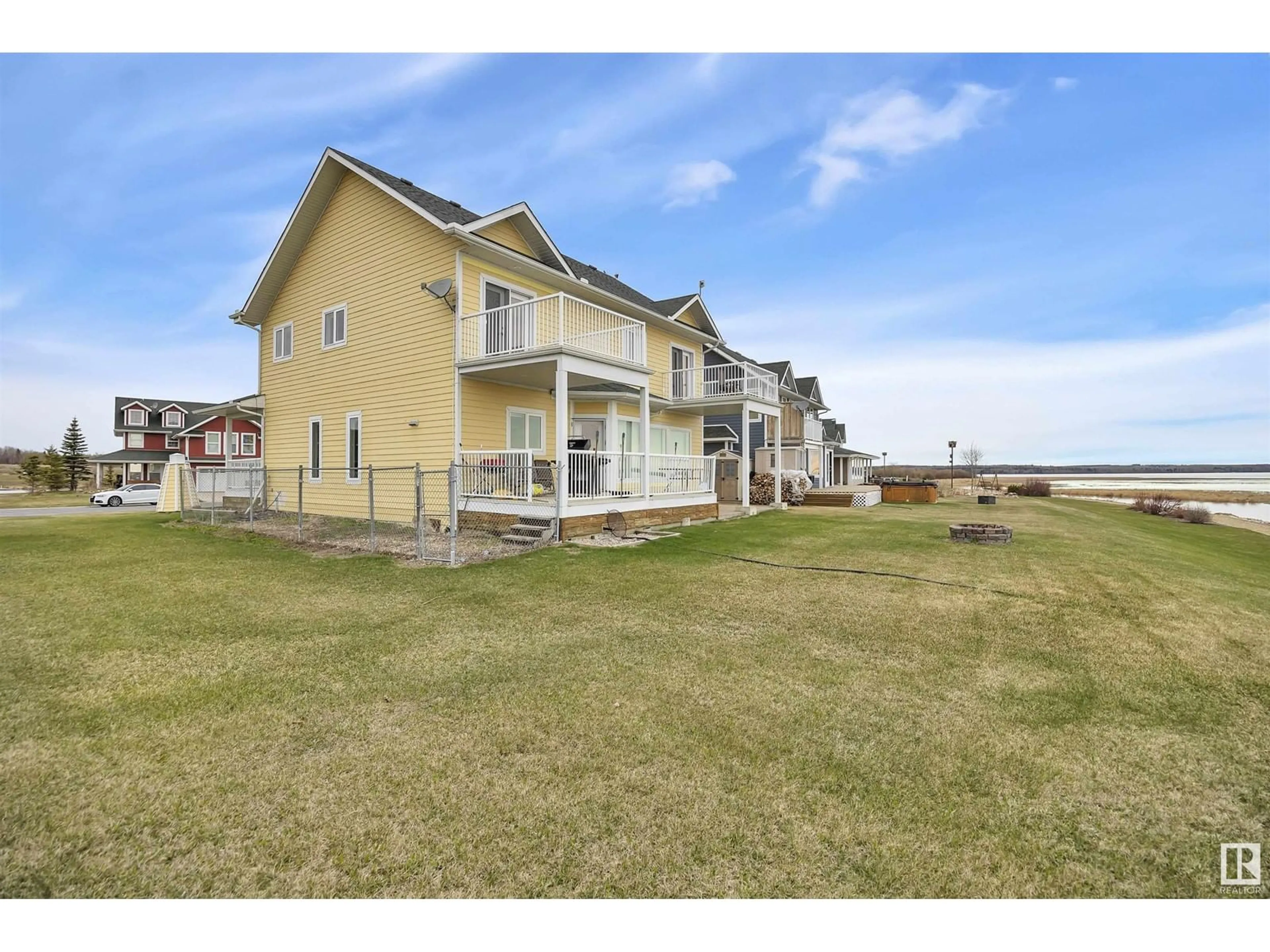 A pic from outside/outdoor area/front of a property/back of a property/a pic from drone, water/lake/river/ocean view for #59 Sunset HB, Rural Wetaskiwin County Alberta T0C1H0