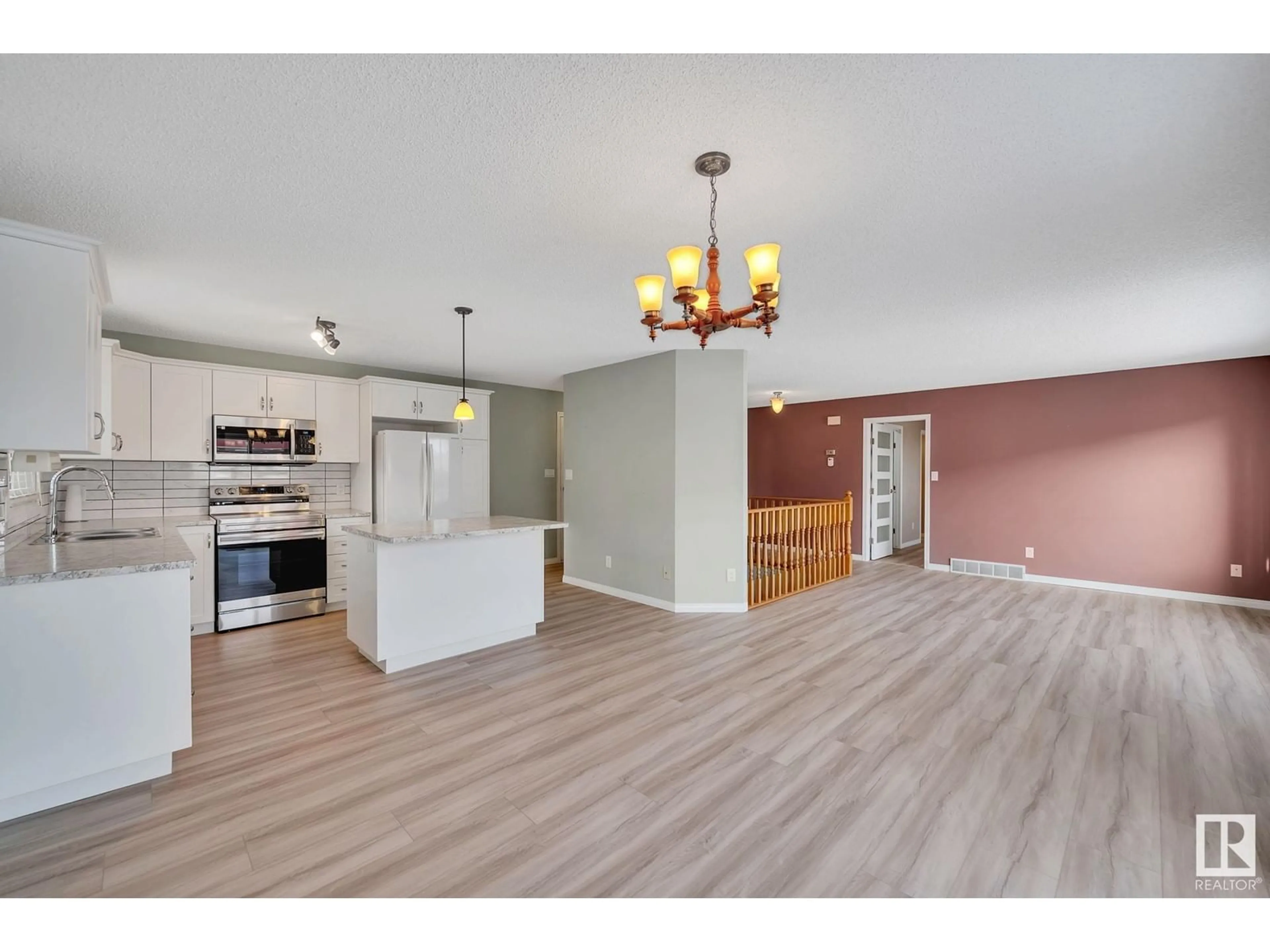 Open concept kitchen, wood/laminate floor for 57 4401 37 ST, Stony Plain Alberta T7Z1L3