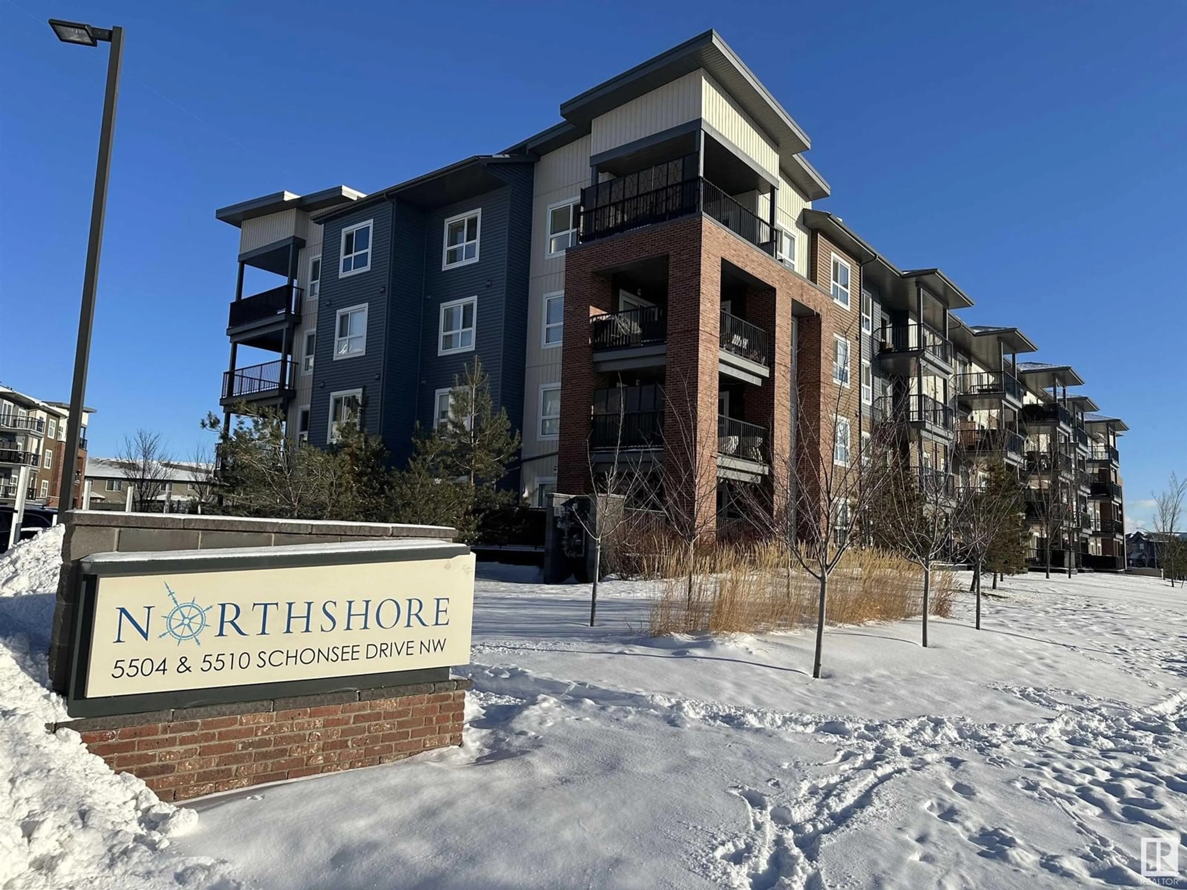 A pic from outside/outdoor area/front of a property/back of a property/a pic from drone, building for #221 5504 SCHONSEE DR NW, Edmonton Alberta T5Z0N9