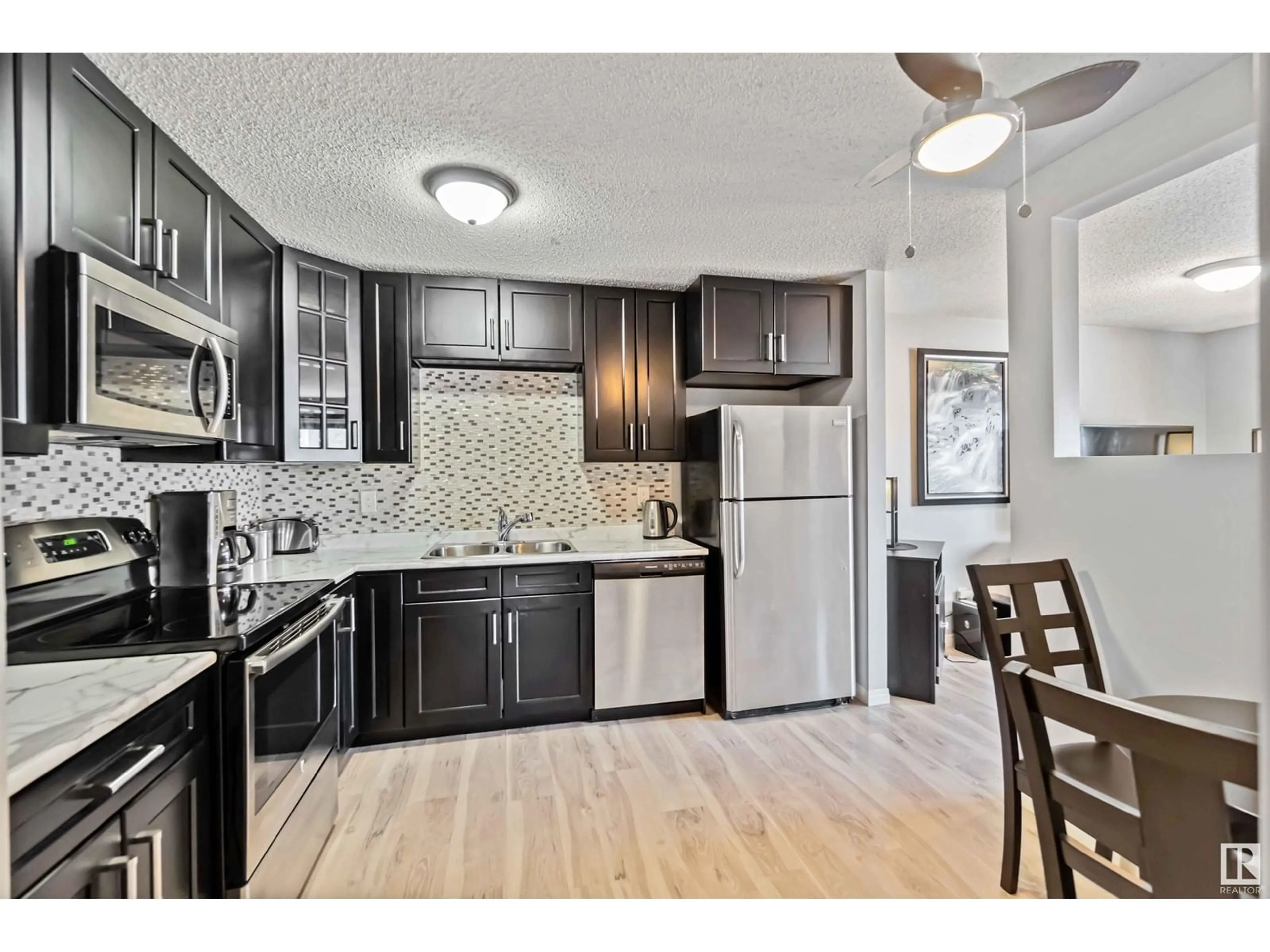 Open concept kitchen, unknown for 17047 100 ST NW, Edmonton Alberta T5X4R8