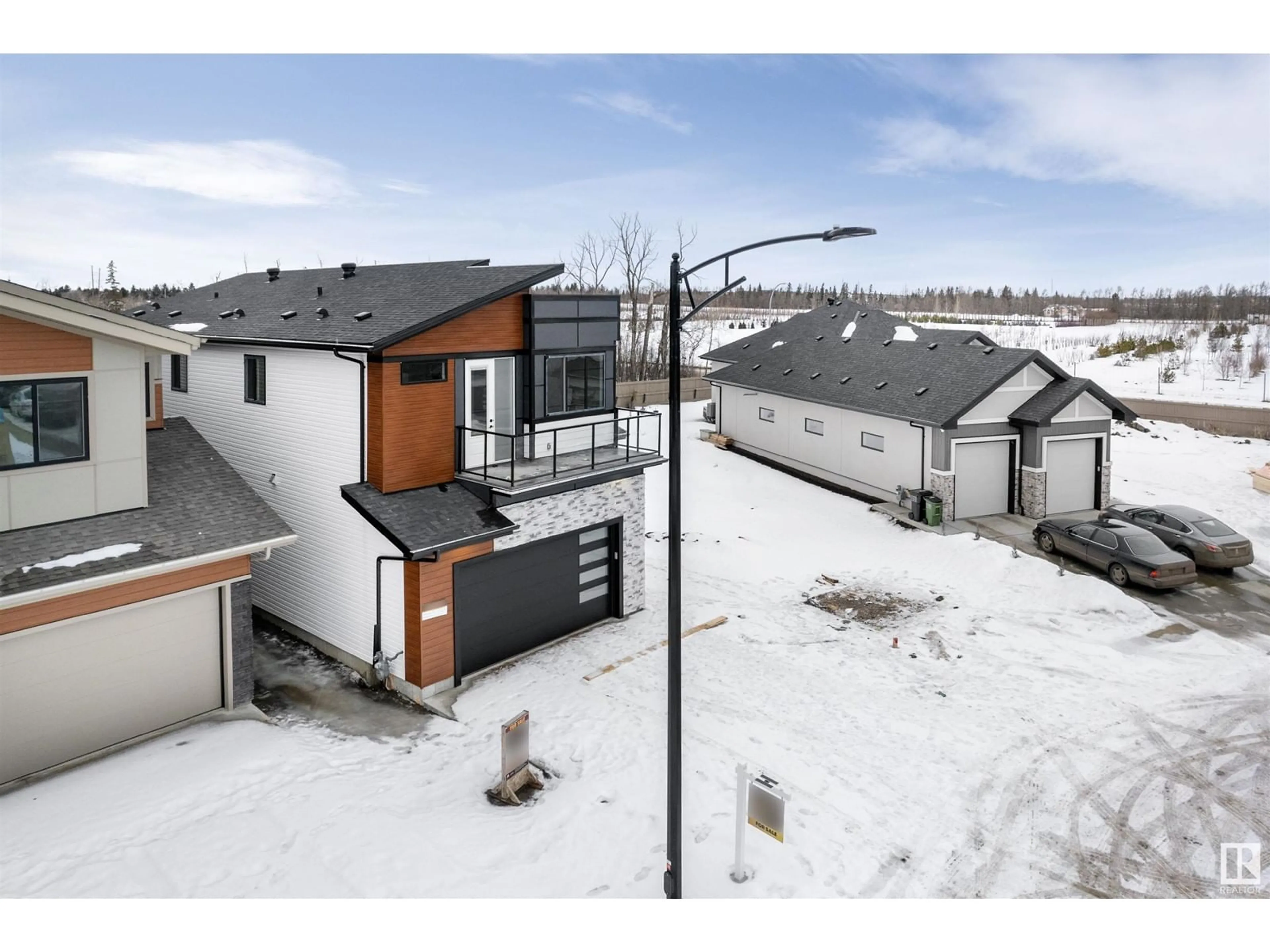 A pic from outside/outdoor area/front of a property/back of a property/a pic from drone, street for 248 166 AV NE, Edmonton Alberta T5Y4J2