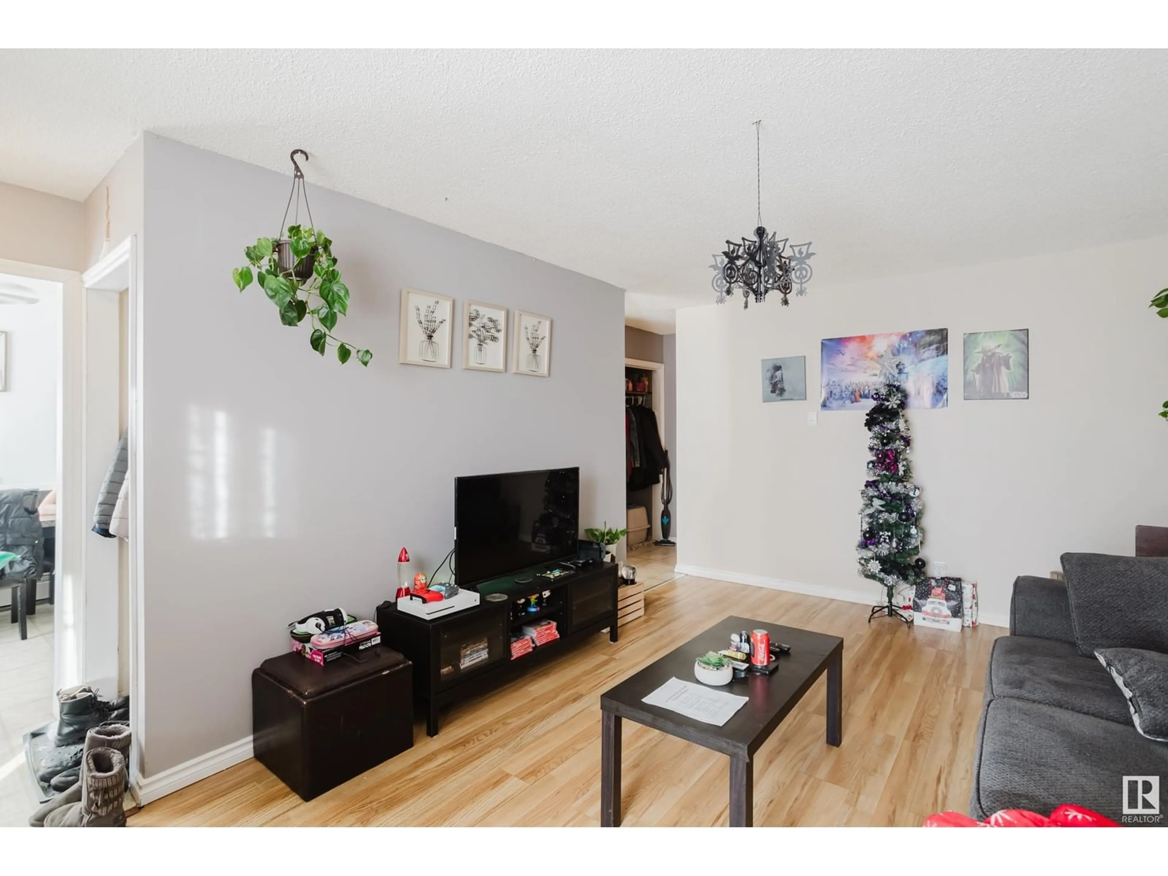 Living room with furniture, wood/laminate floor for 5829 52 ST, Wetaskiwin Alberta T9A2W5