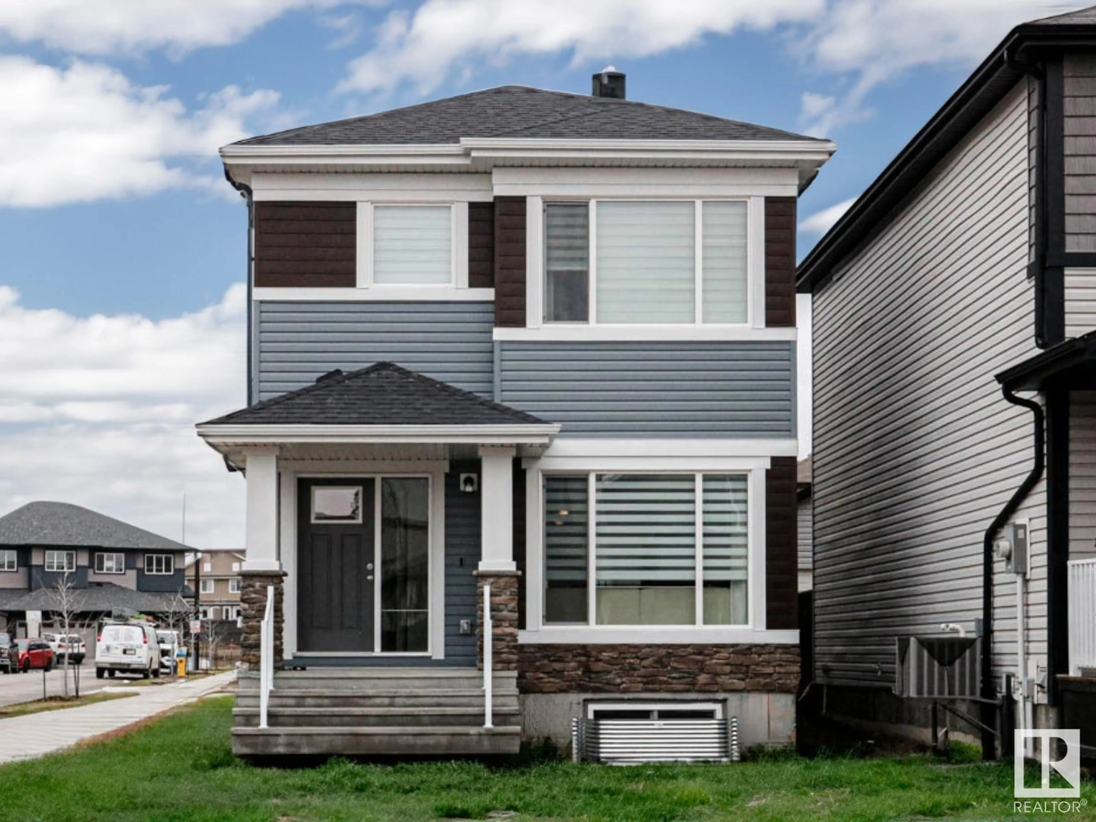 Home with vinyl exterior material, street for 849 Cy Becker DR NW, Edmonton Alberta T5Y3P6