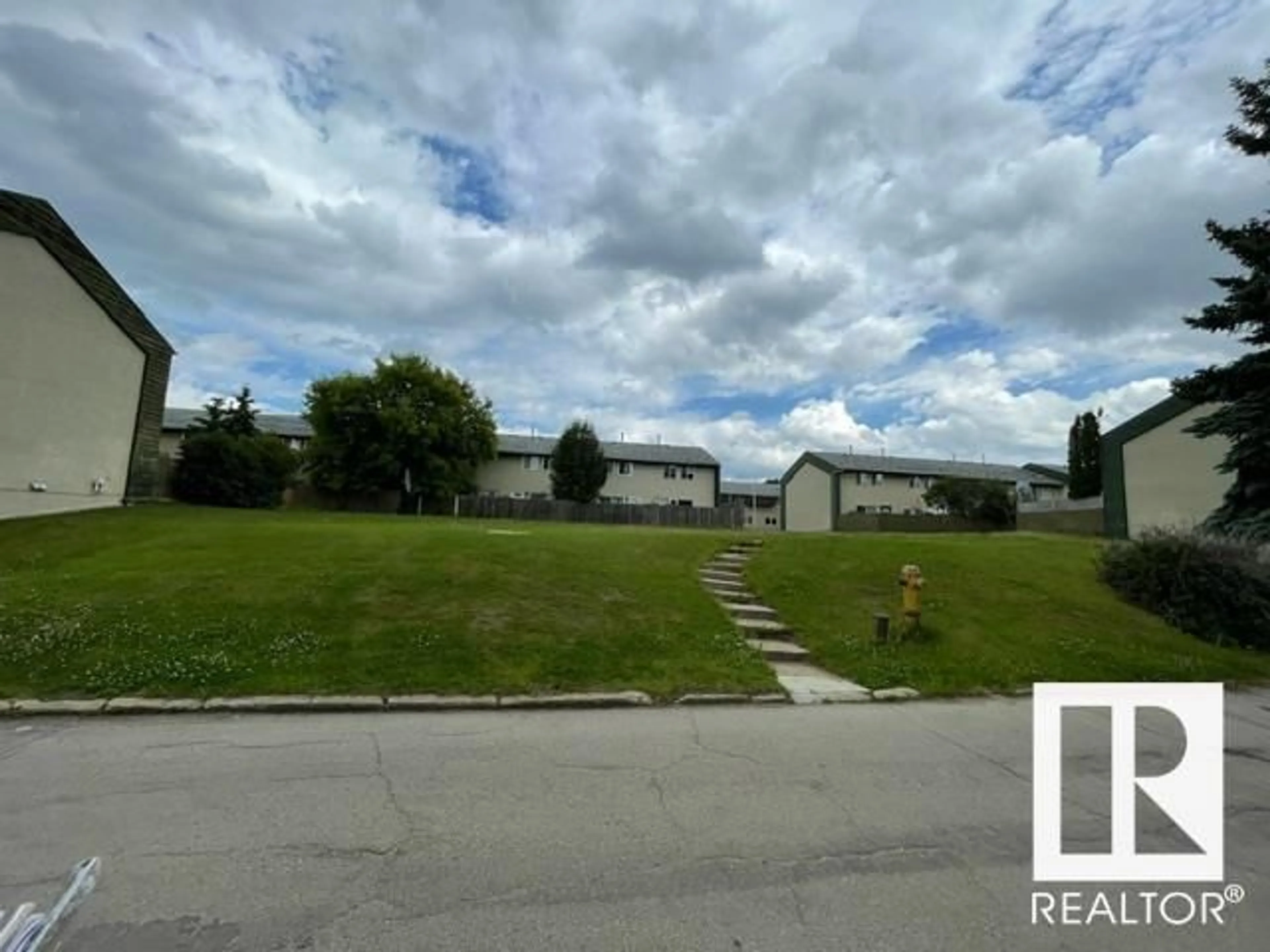 A pic from outside/outdoor area/front of a property/back of a property/a pic from drone, street for 774 ABBOTTSFIELD RD NW, Edmonton Alberta T5W4R4