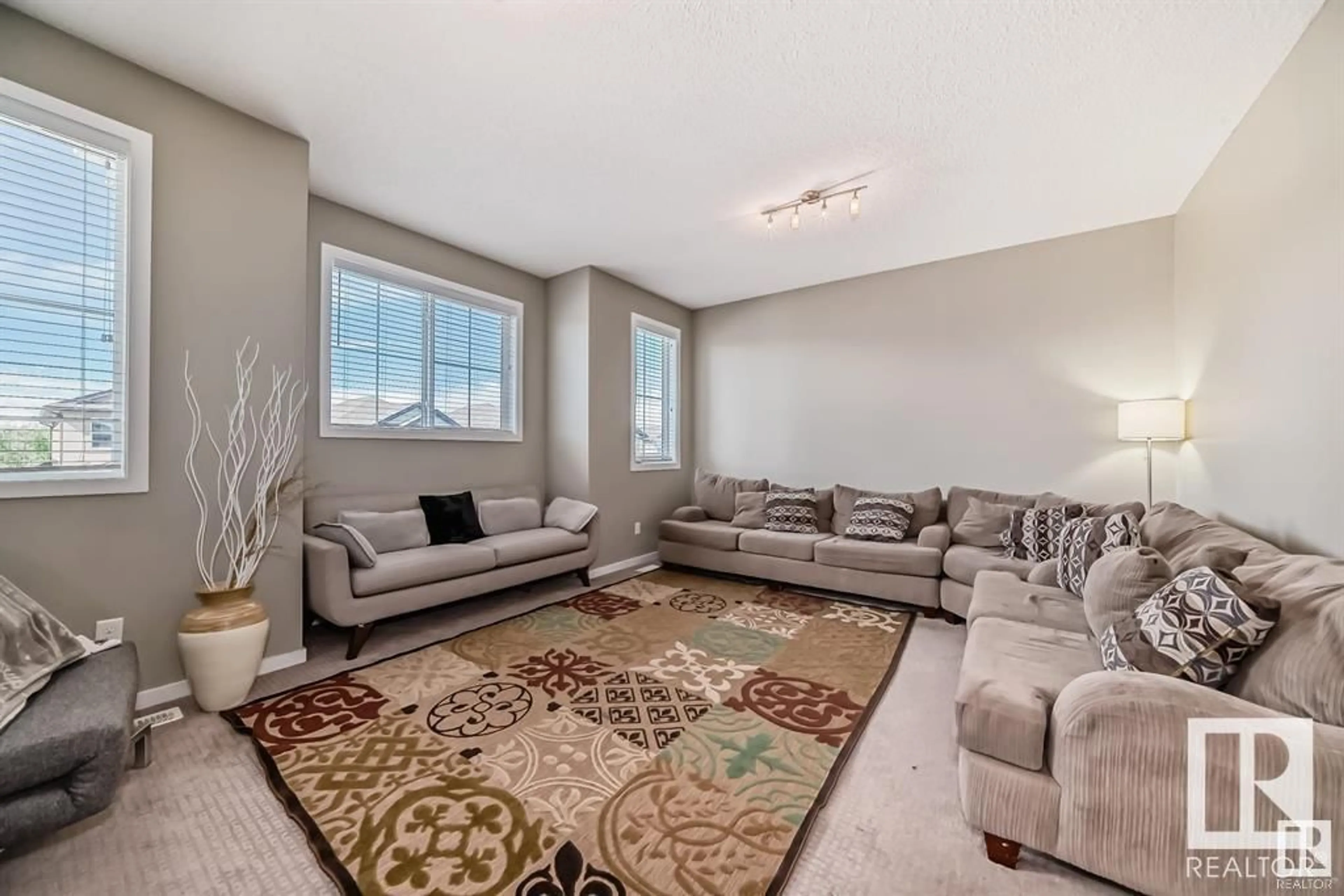 Living room with furniture, carpet floor for 13827 143 AV NW, Edmonton Alberta T6V0L7