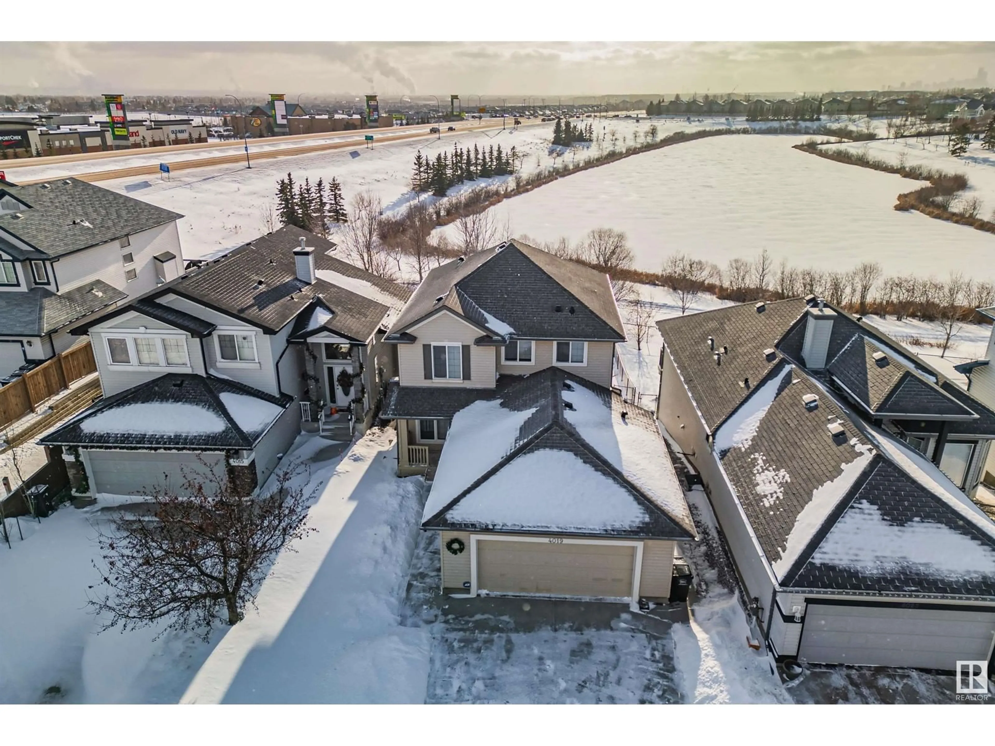 A pic from outside/outdoor area/front of a property/back of a property/a pic from drone, water/lake/river/ocean view for 4019 157 AV NW, Edmonton Alberta T5Y0E1