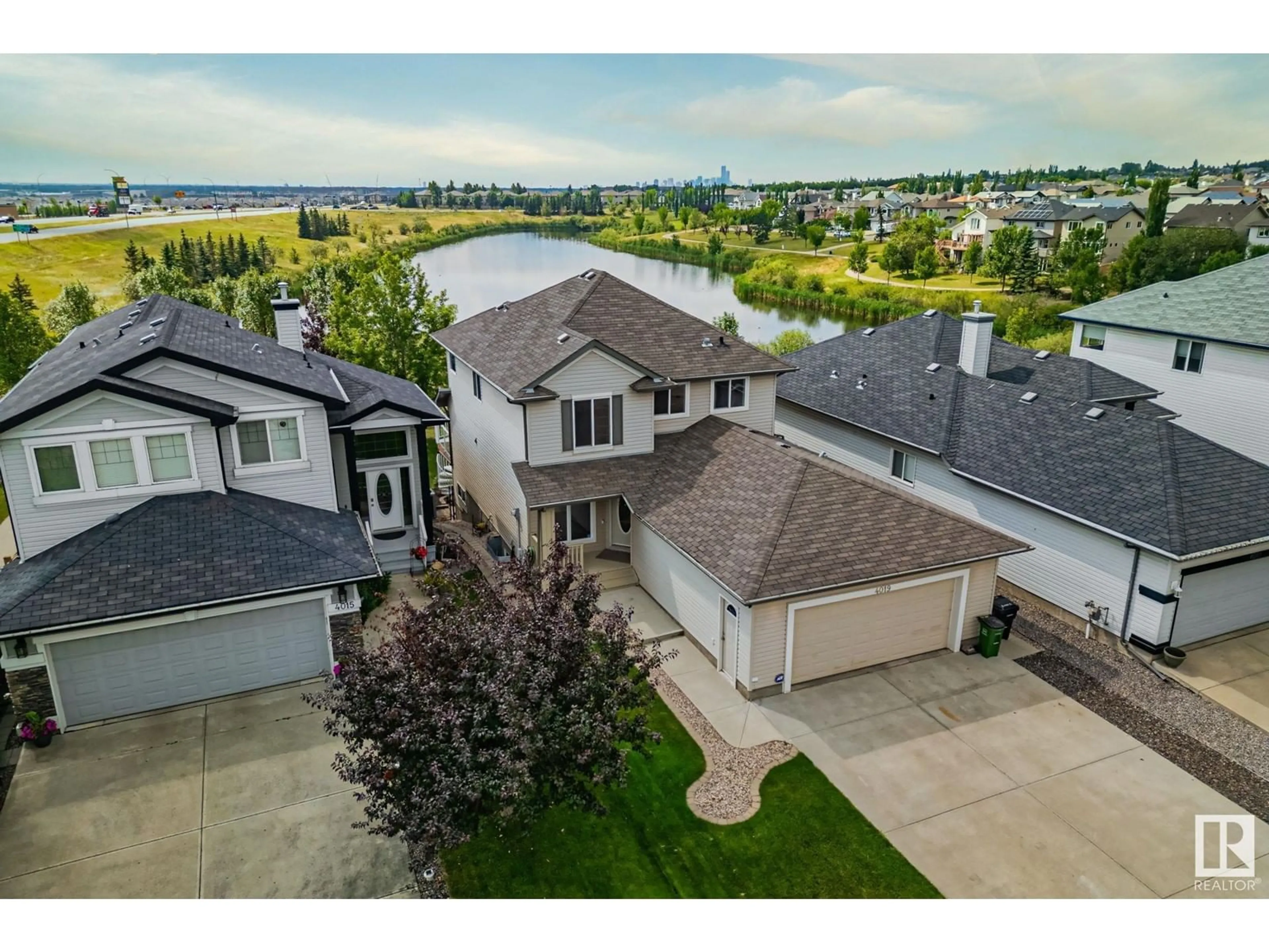 A pic from outside/outdoor area/front of a property/back of a property/a pic from drone, street for 4019 157 AV NW, Edmonton Alberta T5Y0E1