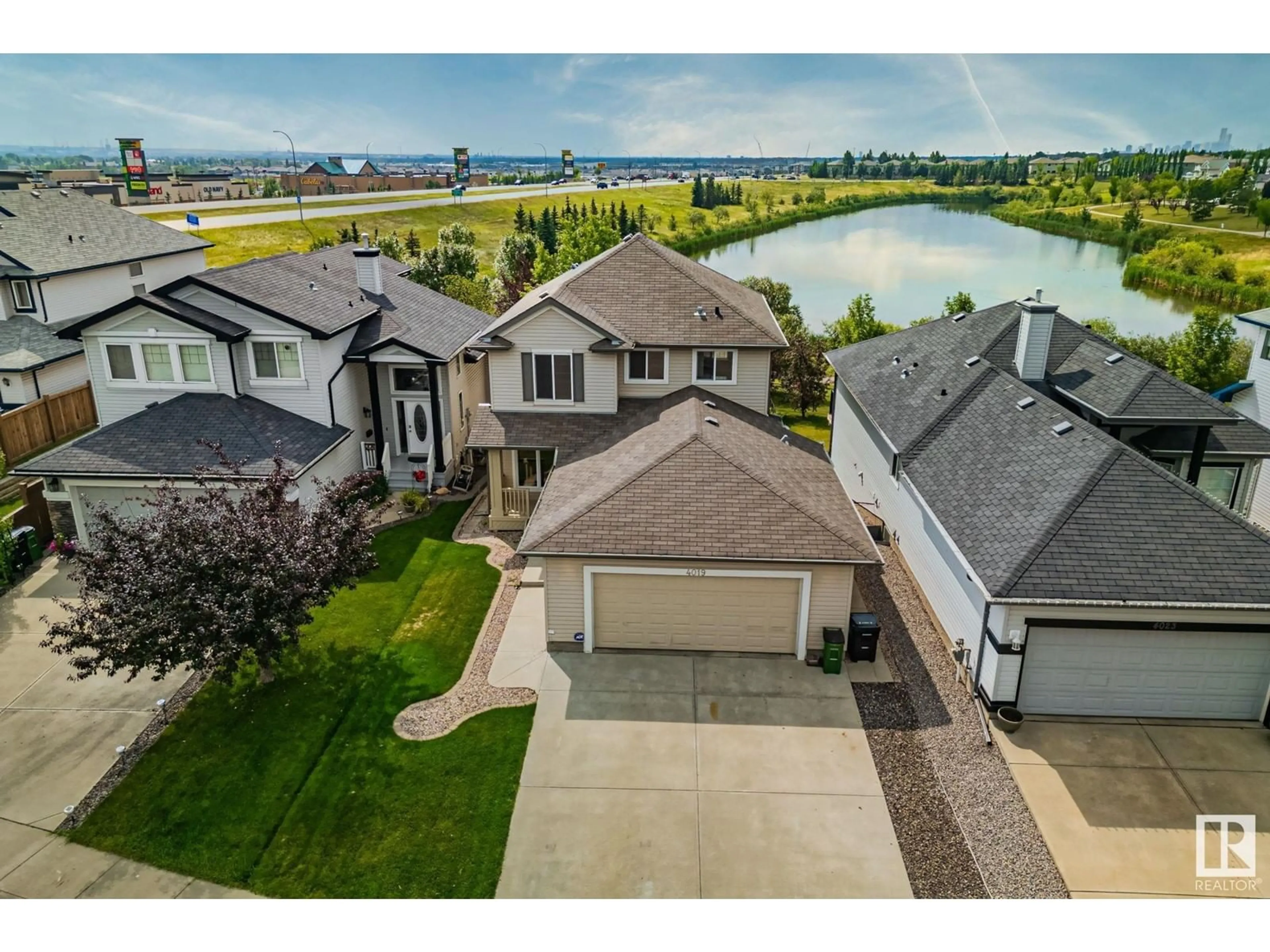 A pic from outside/outdoor area/front of a property/back of a property/a pic from drone, water/lake/river/ocean view for 4019 157 AV NW, Edmonton Alberta T5Y0E1