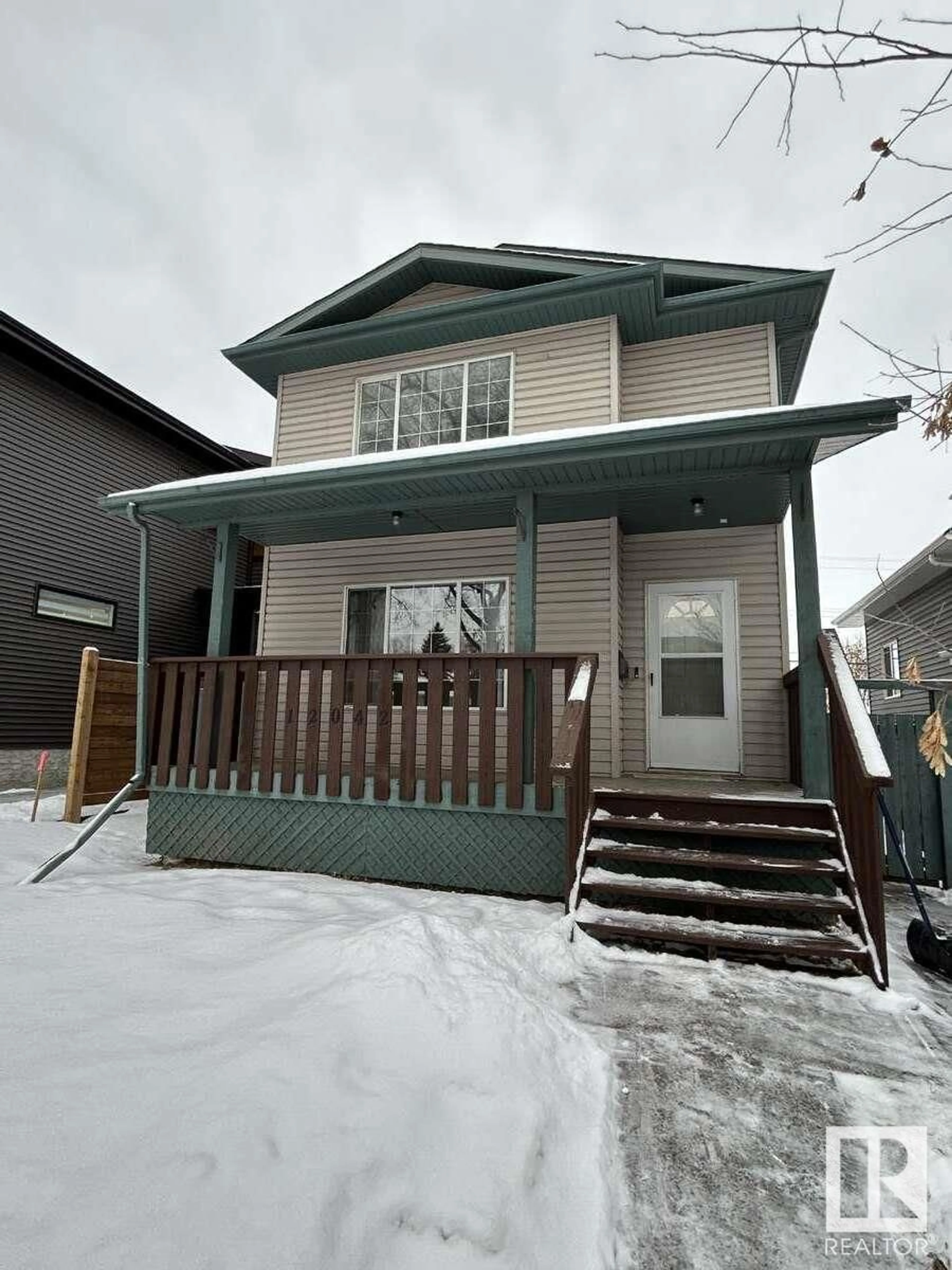 Home with vinyl exterior material, street for 12042 65 ST NW, Edmonton Alberta T5W4L7