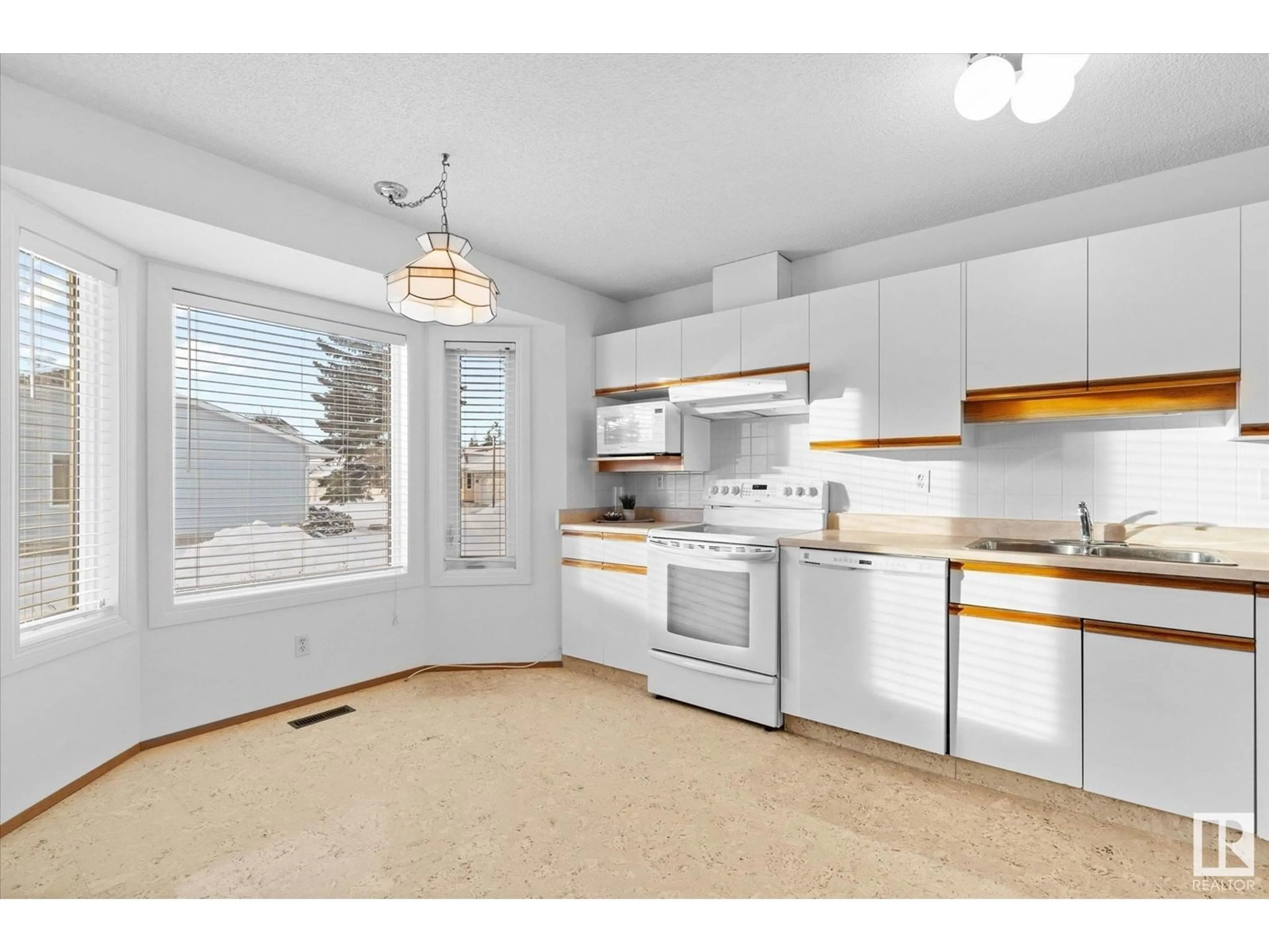 Open concept kitchen, unknown for 5941 189 ST NW, Edmonton Alberta T6M2J2