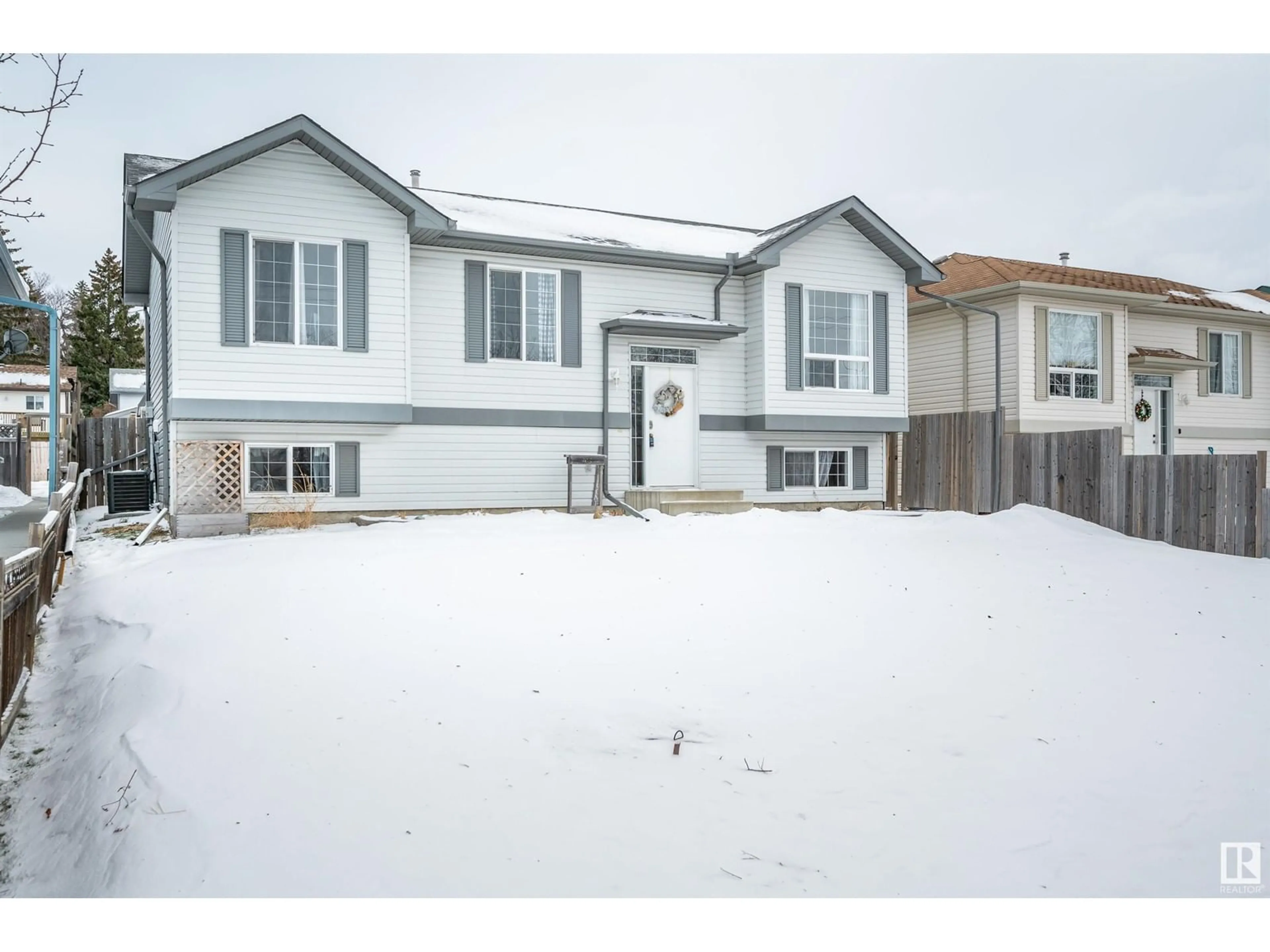 Home with vinyl exterior material, street for 23 SPRUCE MEADOW LN, Bon Accord Alberta T0A0K0