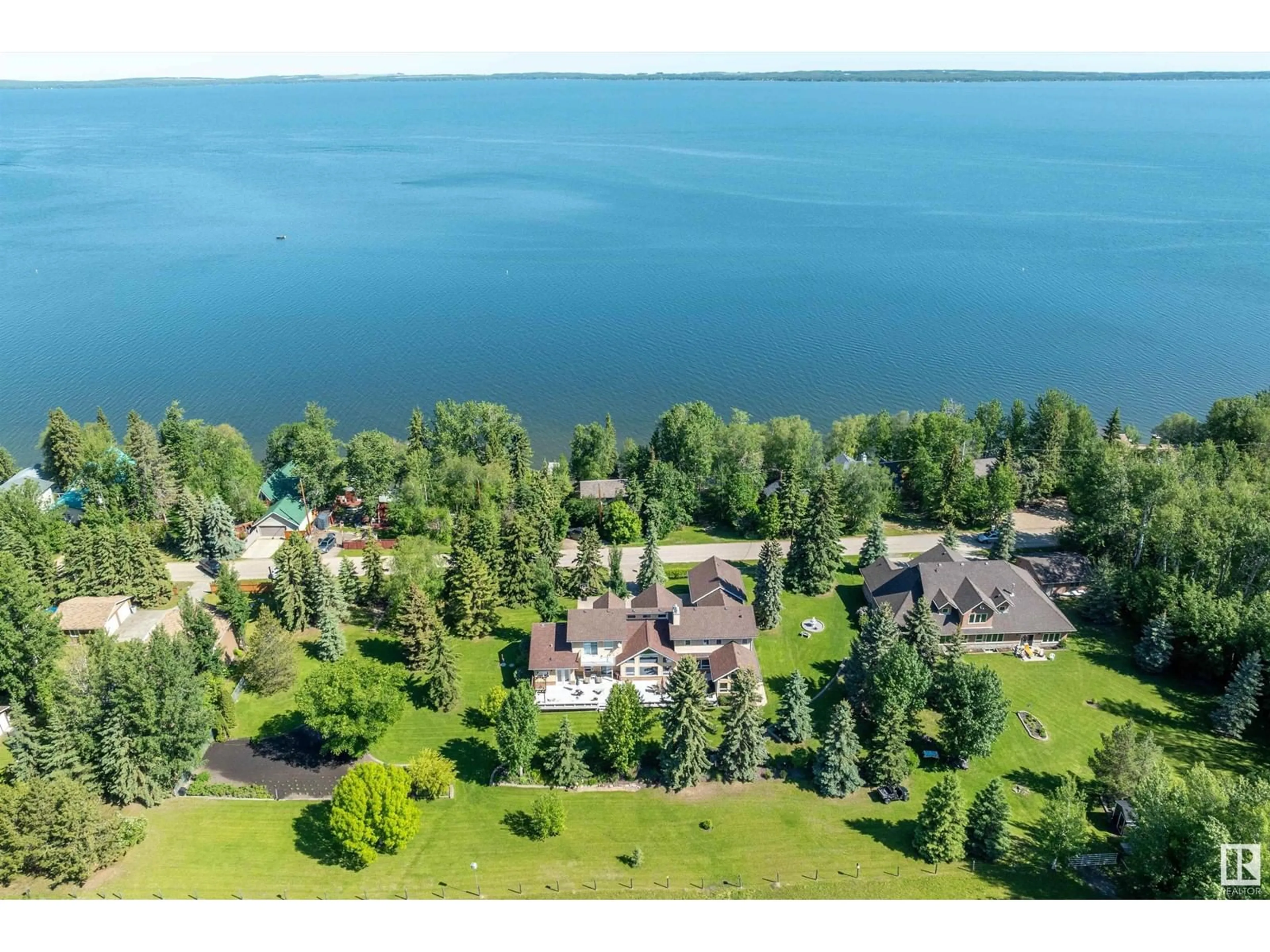 A pic from outside/outdoor area/front of a property/back of a property/a pic from drone, water/lake/river/ocean view for 248 Lakeshore Dr, Rural Wetaskiwin County Alberta T0C2V0