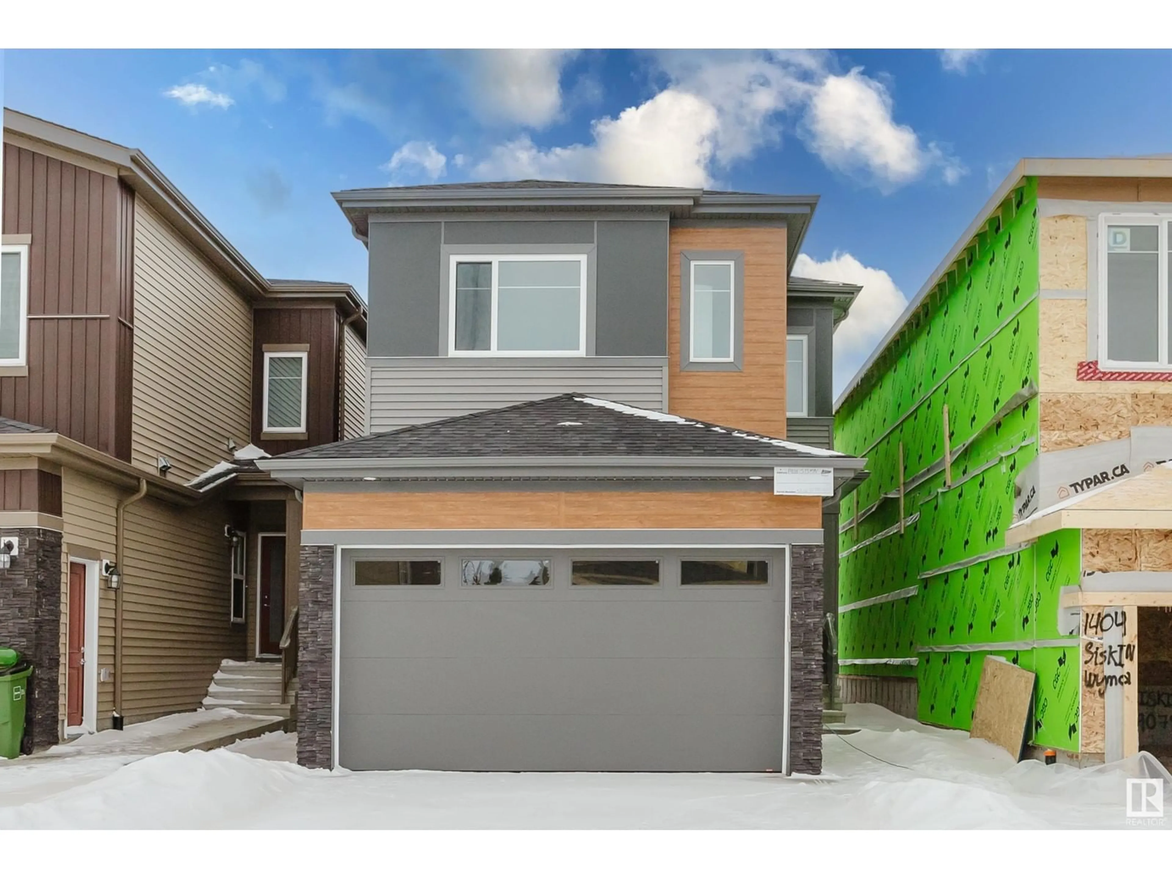 Home with vinyl exterior material, street for 1406 SISKIN WD NW, Edmonton Alberta T5S0V2