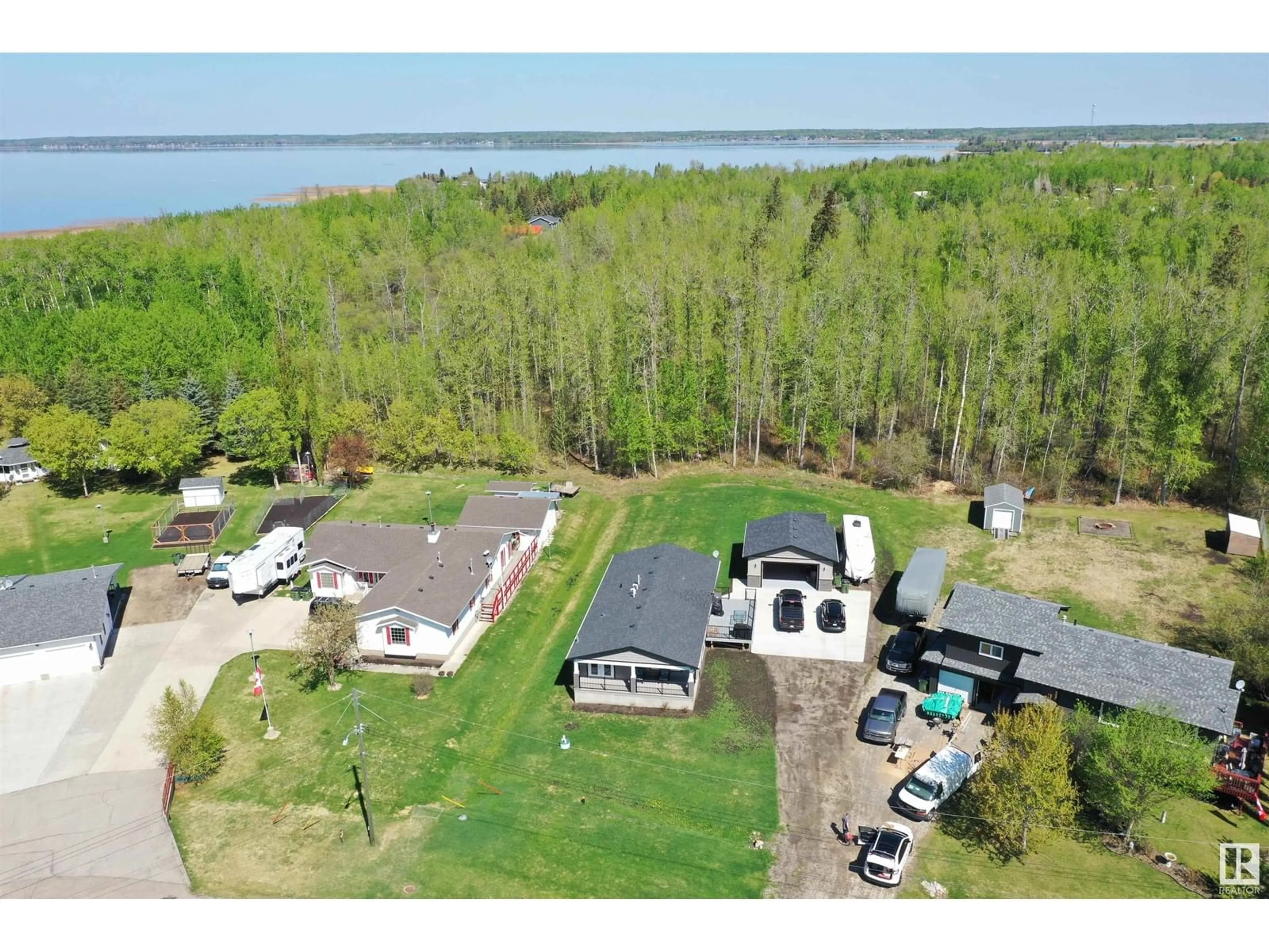 A pic from outside/outdoor area/front of a property/back of a property/a pic from drone, water/lake/river/ocean view for 4816 49A AV, Rural Lac Ste. Anne County Alberta T0E0A0