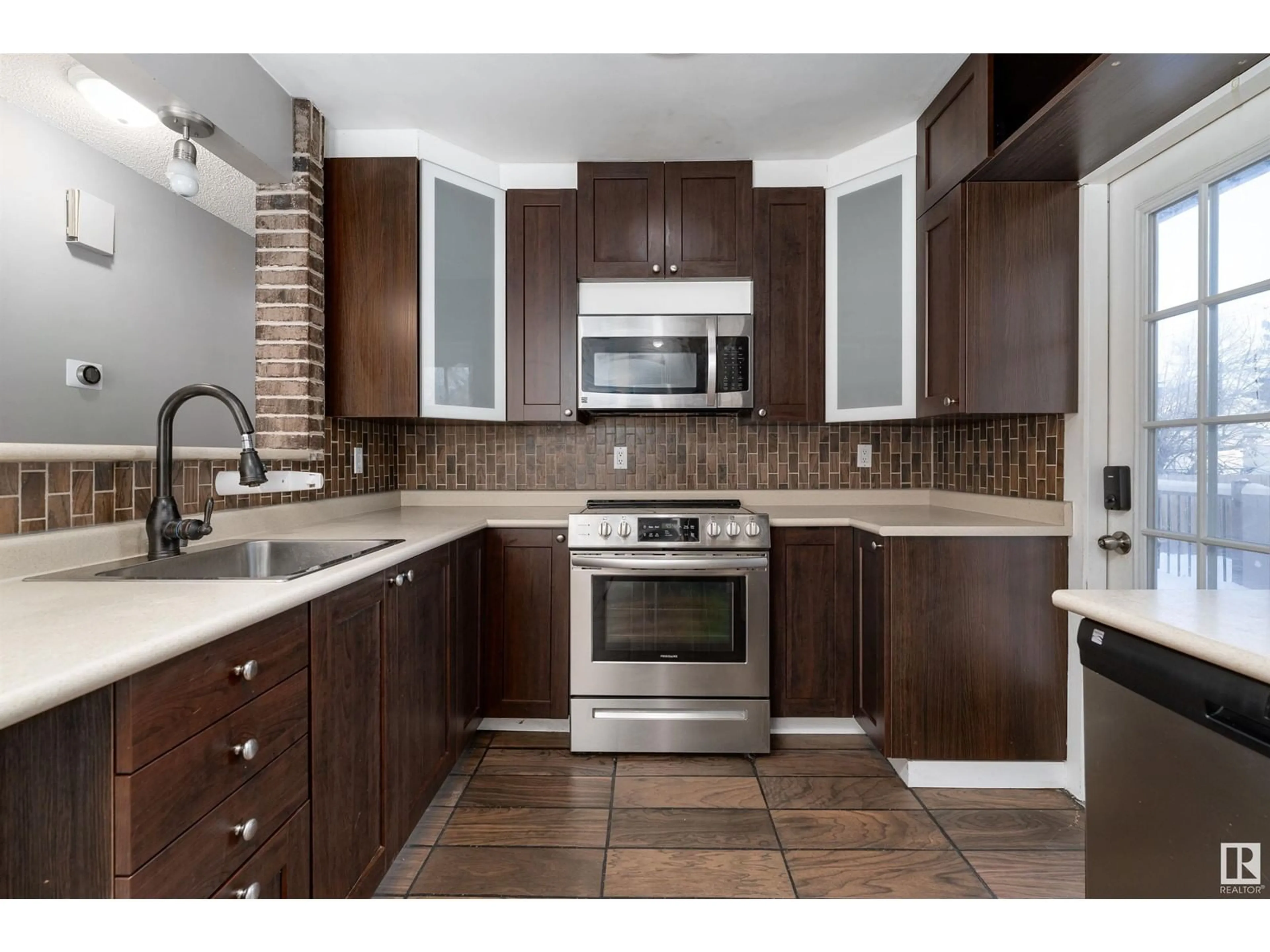 Open concept kitchen, ceramic/tile floor for 12001 45 ST NW, Edmonton Alberta T5W2T7