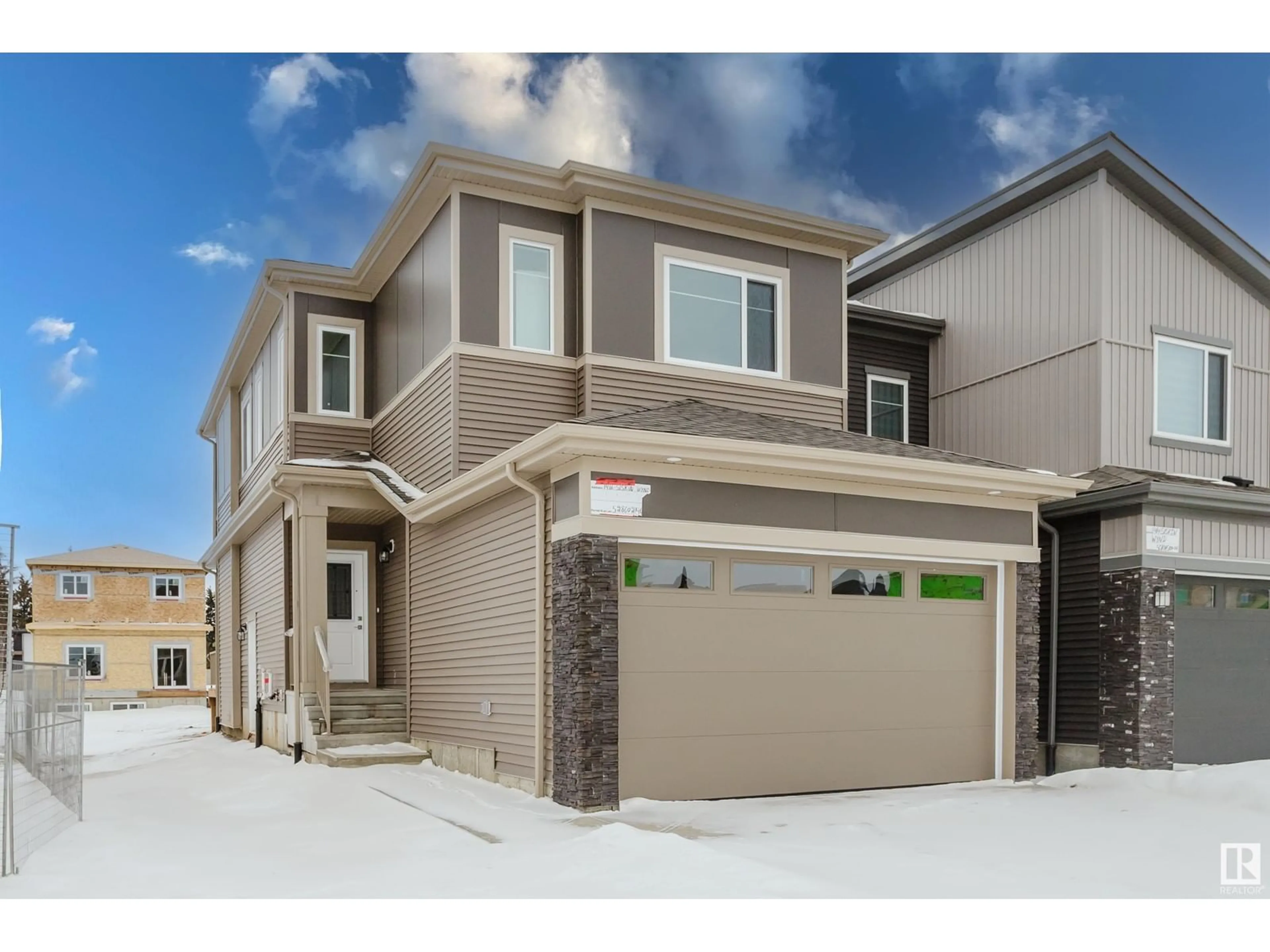 Home with brick exterior material, street for 1416 SISKIN WD NW, Edmonton Alberta T5S0V2