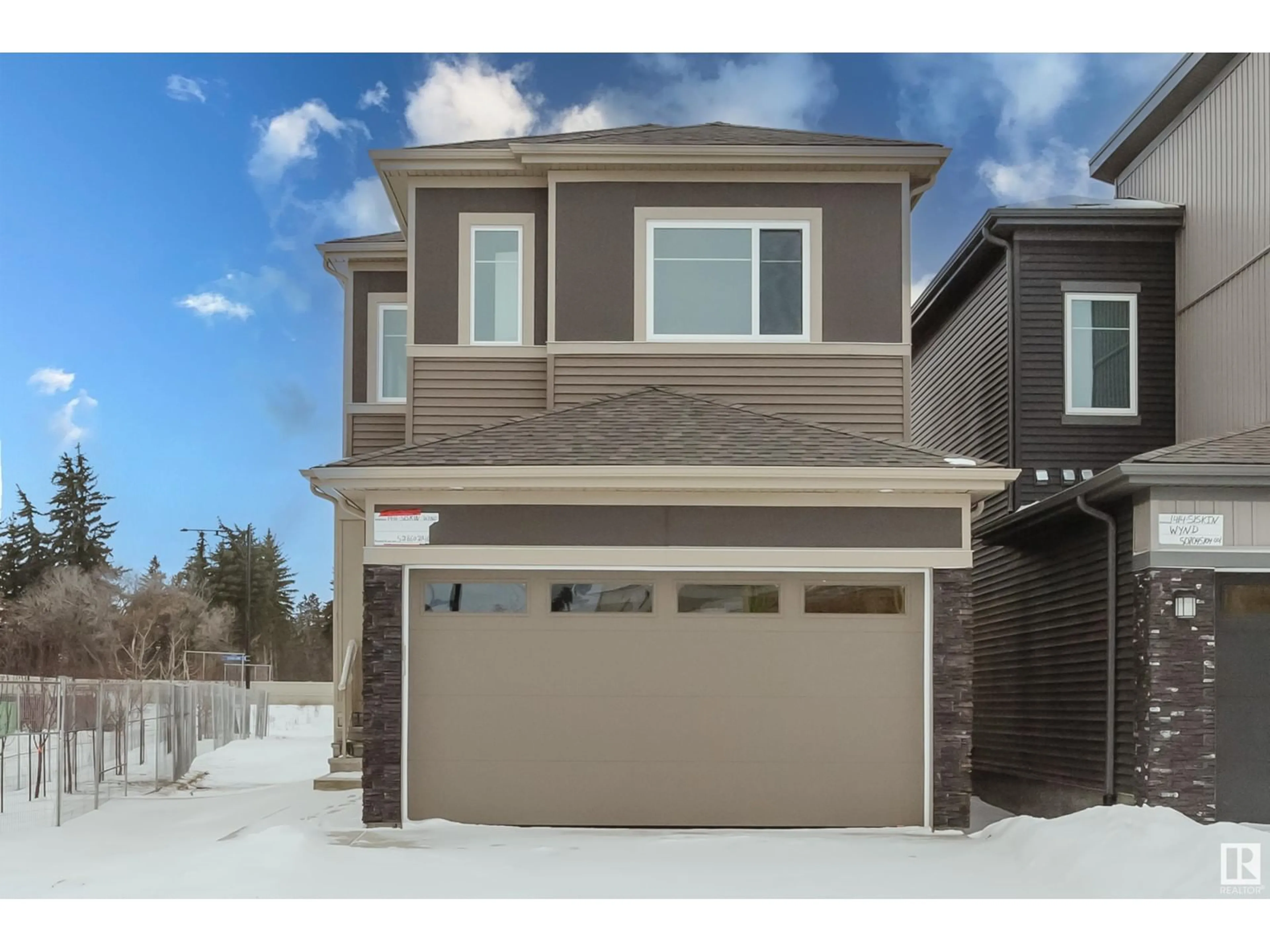 Home with vinyl exterior material, street for 1416 SISKIN WD NW, Edmonton Alberta T5S0V2