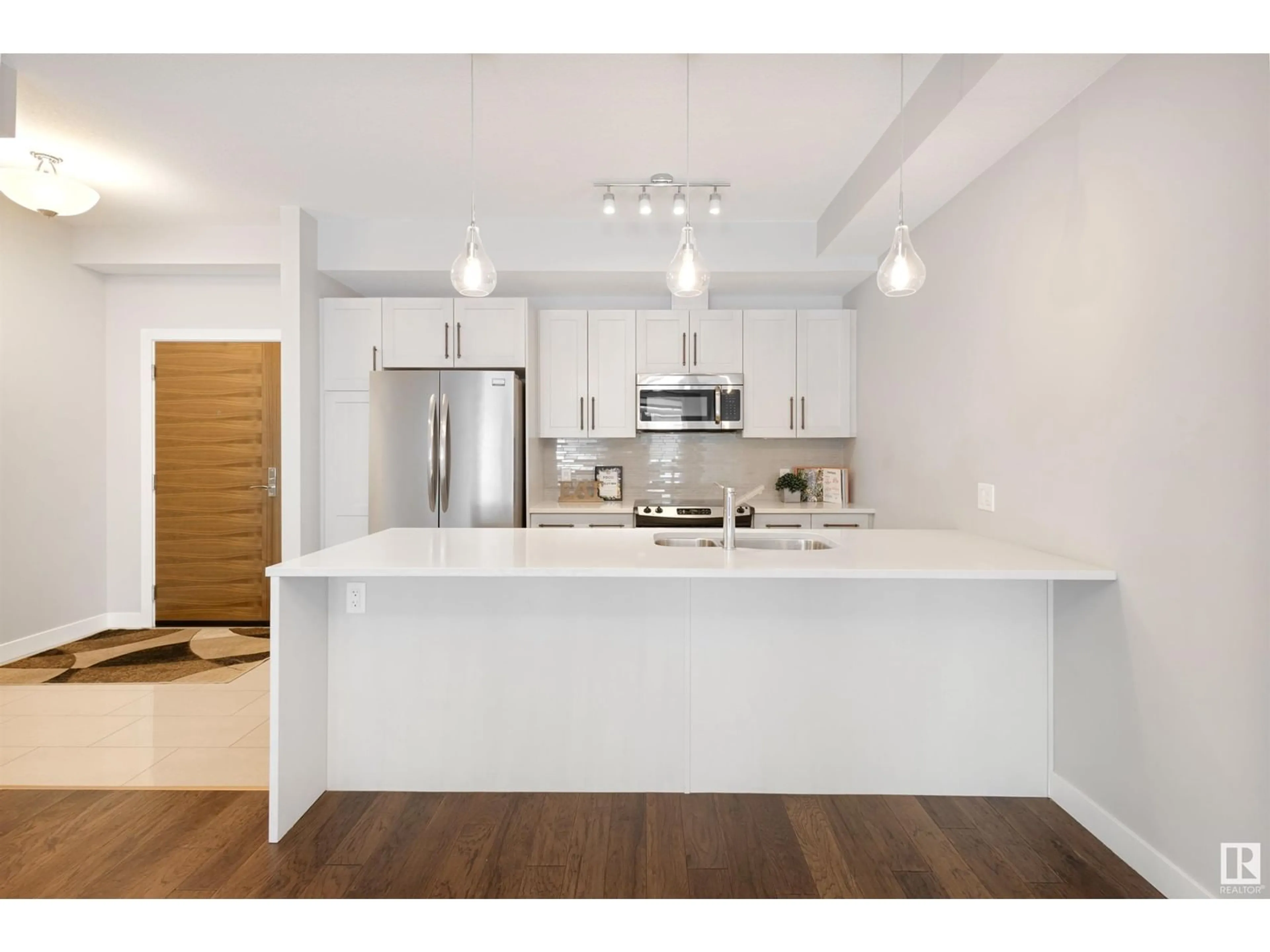 Open concept kitchen, unknown for #108 625 LEGER WY NW, Edmonton Alberta T6R2T1