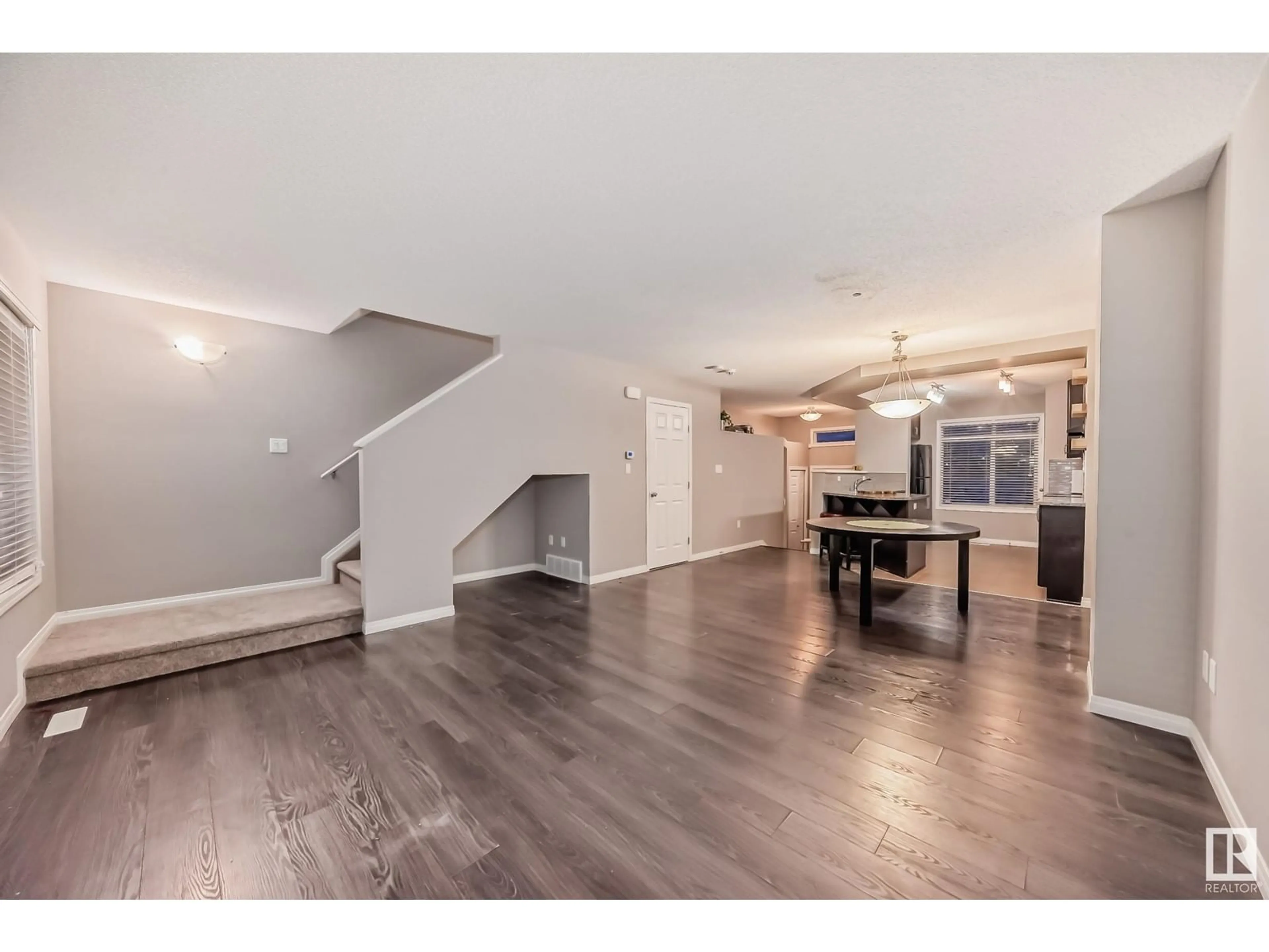 Open concept kitchen, wood/laminate floor for #65 7503 GETTY GATE GA NW, Edmonton Alberta T5T4S8