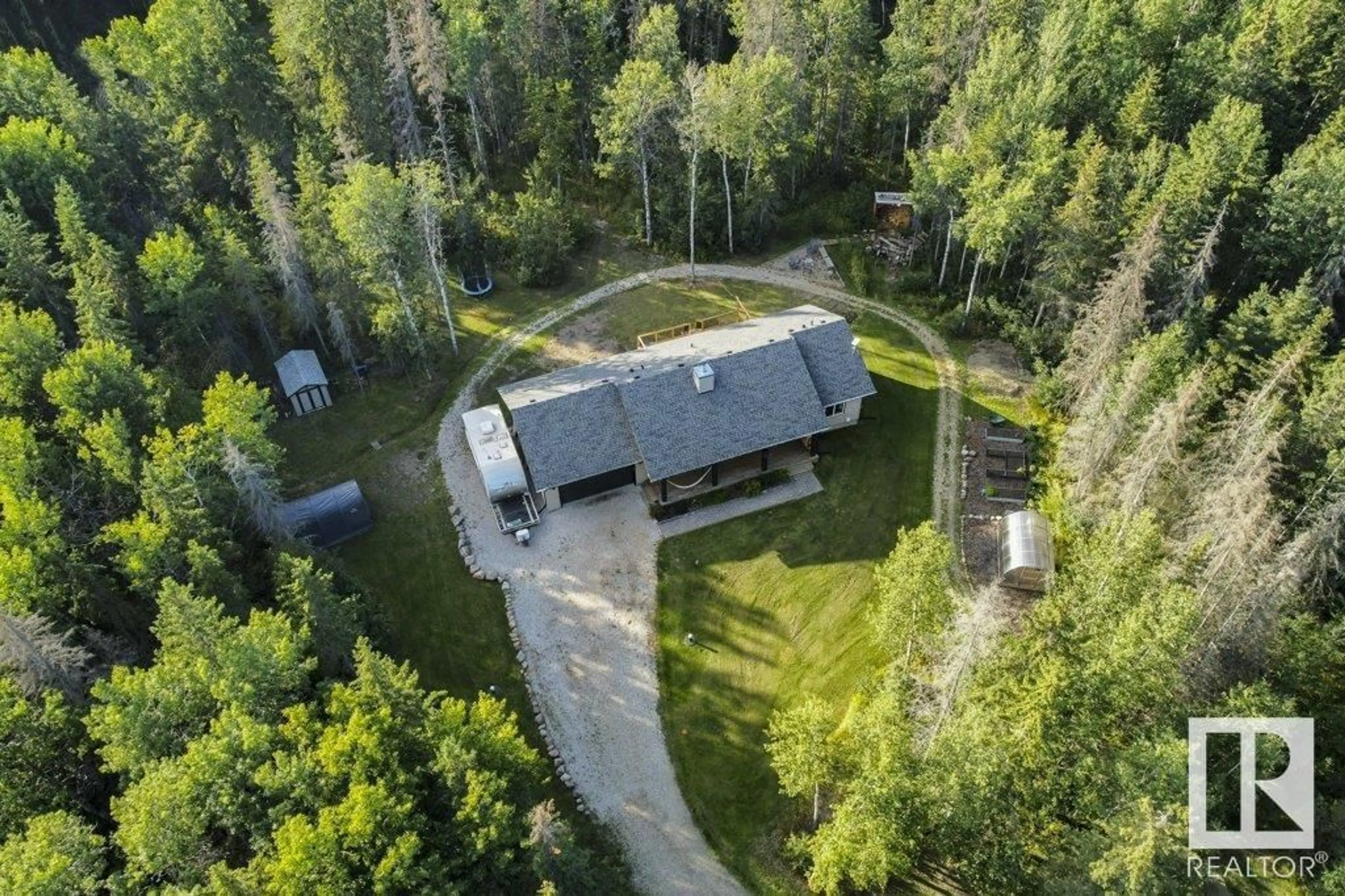 A pic from outside/outdoor area/front of a property/back of a property/a pic from drone, forest/trees view for #203 55504 RGE RD 13, Rural Lac Ste. Anne County Alberta T0E1J0