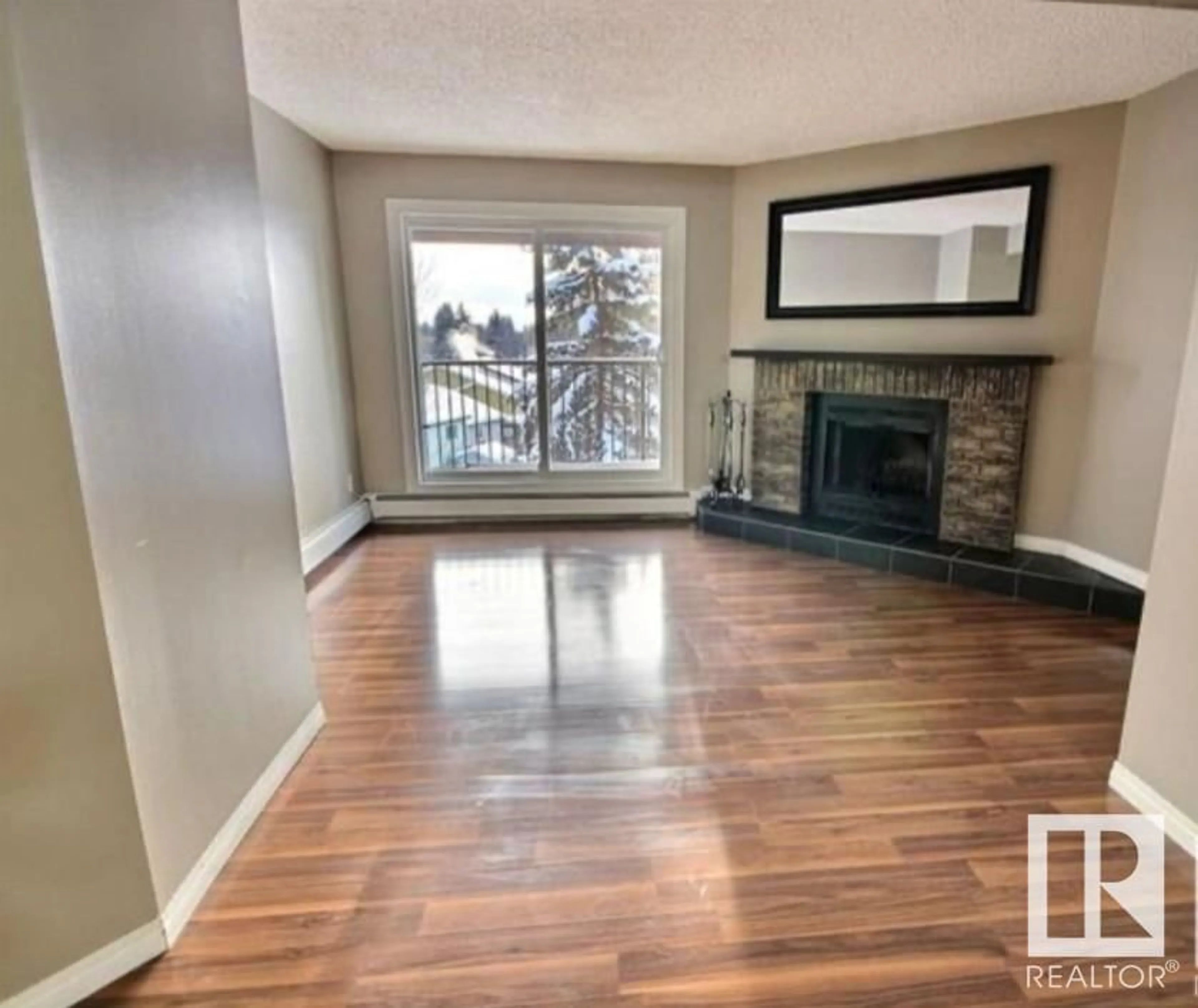 Living room with furniture, wood/laminate floor for 5043 TUDOR GL, St. Albert Alberta T8N3V4