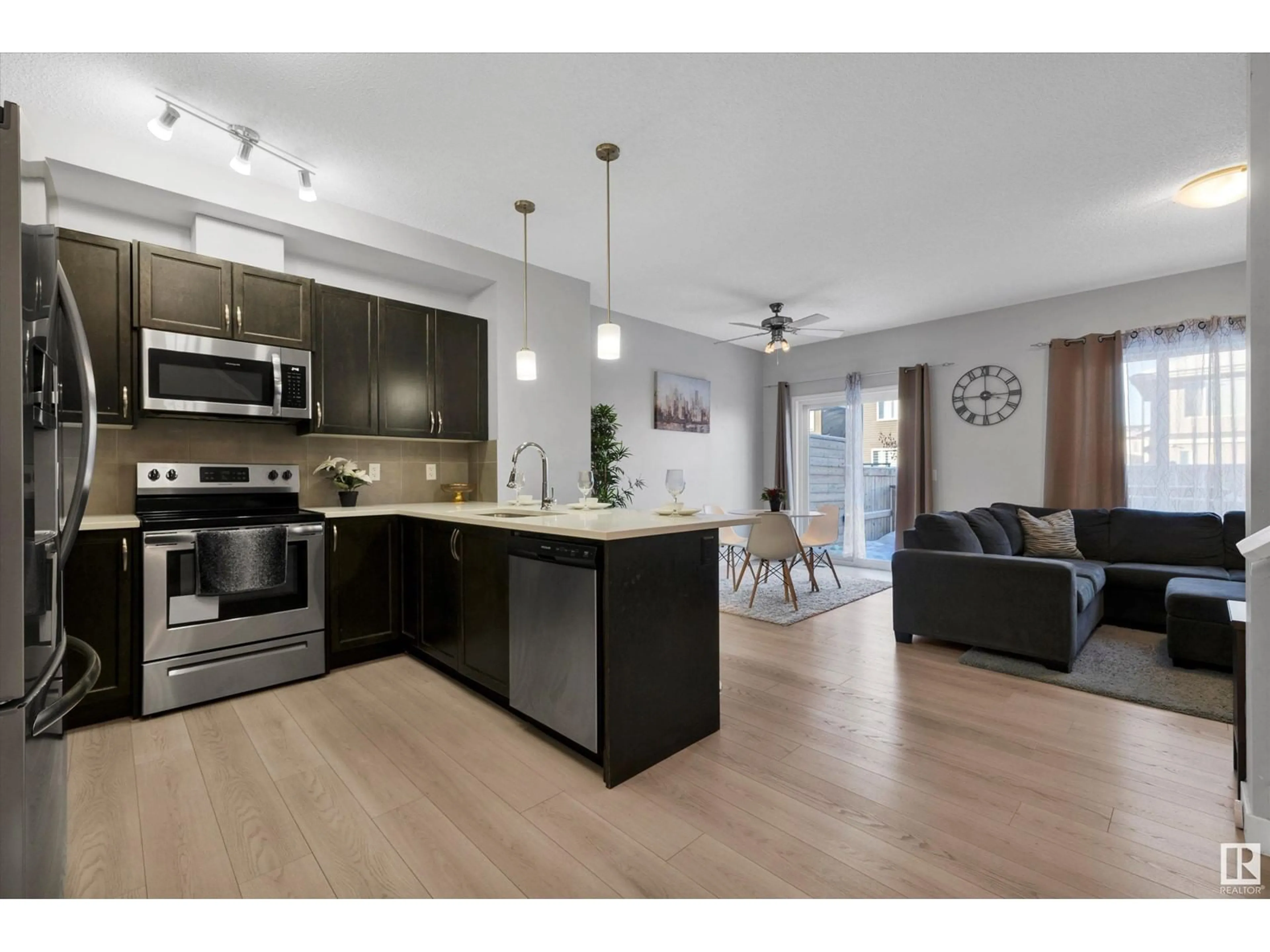 Open concept kitchen, wood/laminate floor for 412 CRYSTALLINA NERA DR NW, Edmonton Alberta T5Z0P3